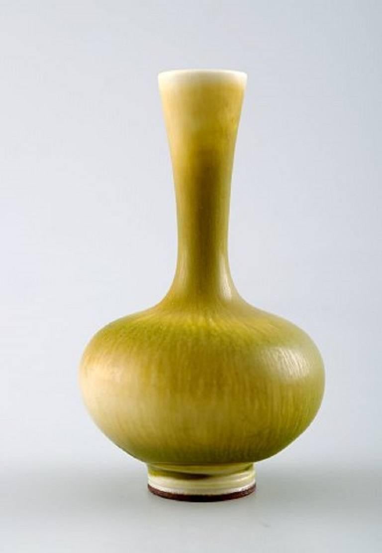 Berndt Friberg Studio ceramic vase. Modern Swedish design. Unique, handmade.
Fantastic glaze in yellow-green tones.
Perfect condition. 1st. assortment.
Measures: 7.5 cm. x 4.5 cm.
Signed.