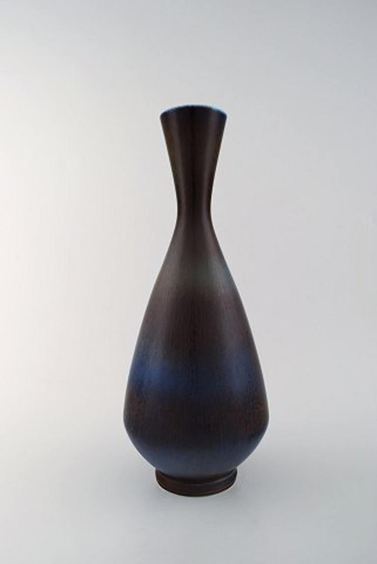 Berndt Friberg Studio large ceramic vase. Modern Swedish design. Unique, handmade.
Stamped.
Fine glaze in blue/brown tones.
Perfect condition. 1st. factory quality.
Measures: 37.5 cm. x 15 cm.
