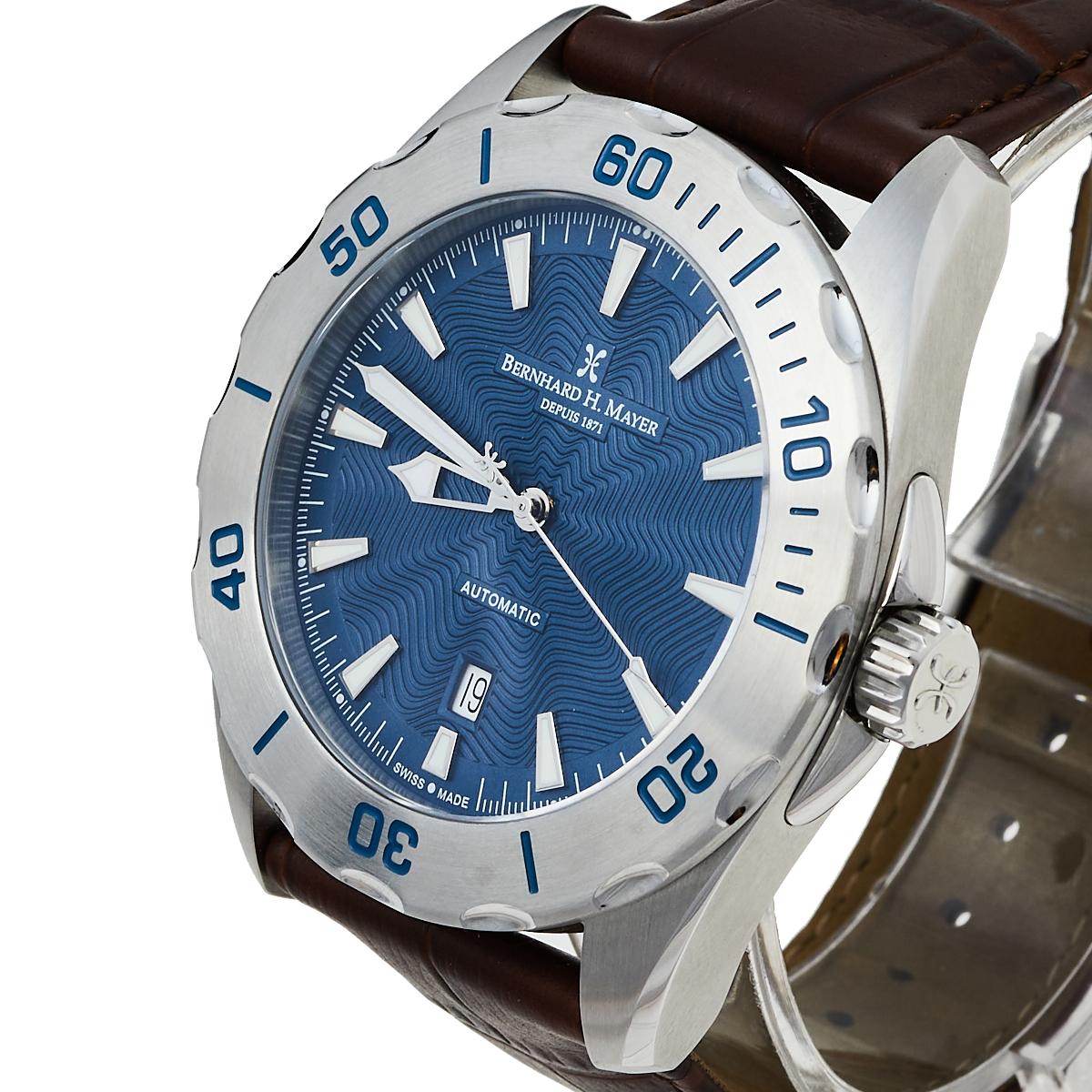 Just as smoothly as a song takes one through memory lanes or through any moment of dullness, this Ballad wristwatch from Bernhard H. Mayer will assist you with ease at a consistent pace. It features a stainless steel case set with an engraved bezel