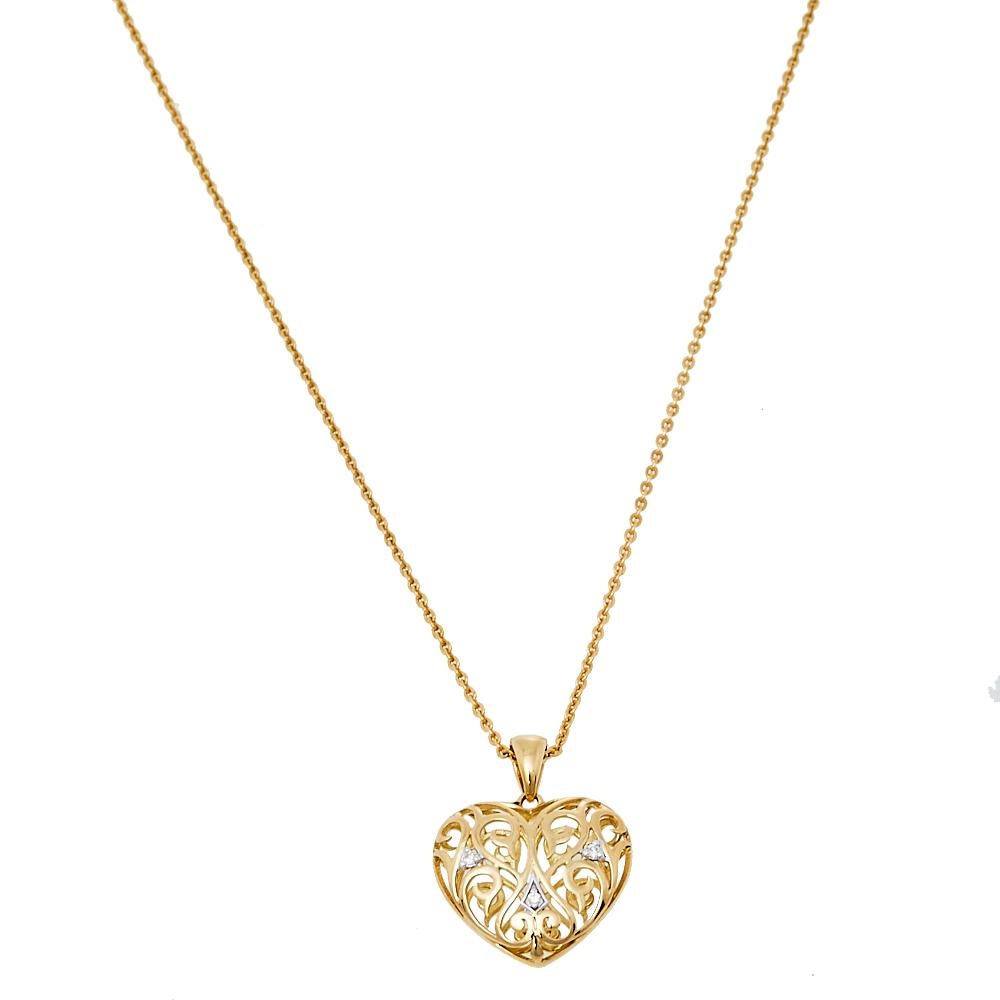 One look at this pendant by Bernhard H. Mayer and you'll know that beauty can come in small things too. Crafted from 18k yellow gold, this beautiful pendant is shaped like a heart with cutouts and meticulously adorned with diamonds. The piece