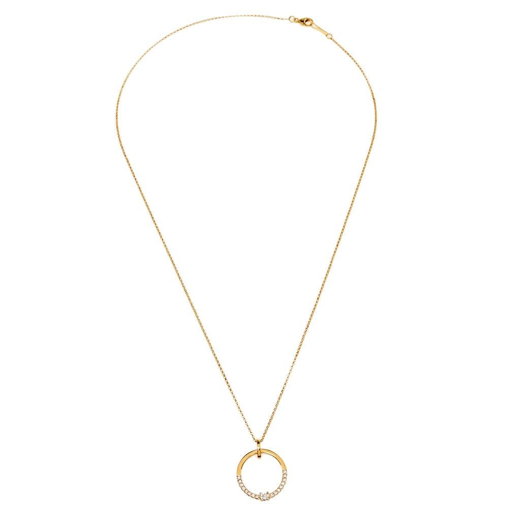 One look at this necklace by Bernhard H. Mayer and you'll know that beauty can come in simple things too. Crafted from 18k yellow gold, this necklace is highlighted by a beautiful pendant. It has been shaped like a ring and meticulously adorned with