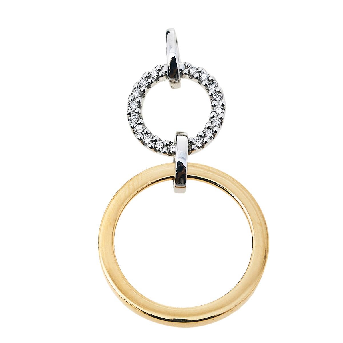 One look at this pendant by Bernhard H. Mayer and you'll know that beauty can come in small things too. Crafted from 18k gold, this pendant flaunts two differently-sized rings attached to one another. While the yellow gold ring represents the Sun,