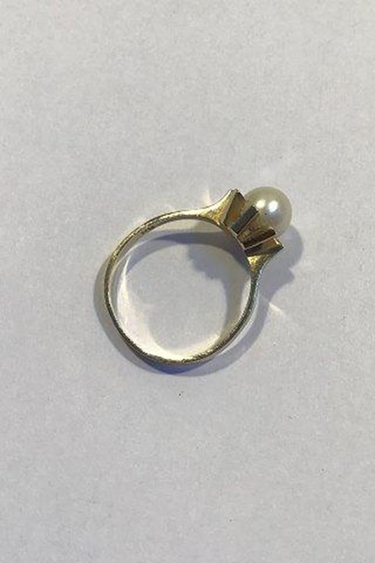 Bernhard Hertz 14K Gold Ring with Pearl.

Ring size 61 US 9½ Weight 3.9 gr/ 0.14 oz.