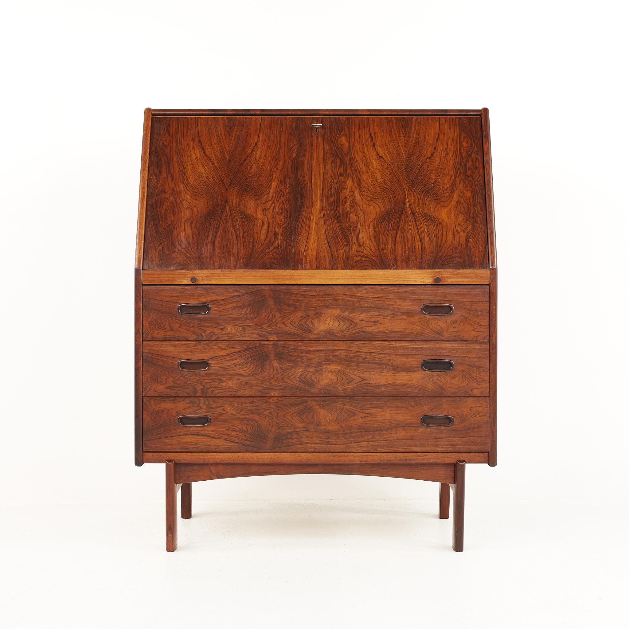 Bernhard Pedersen and Son mid century rosewood drop front secretary desk

The desk measures: 35.5 wide x 16.75 deep x 44.25 inches high

All pieces of furniture can be had in what we call restored vintage condition. That means the piece is