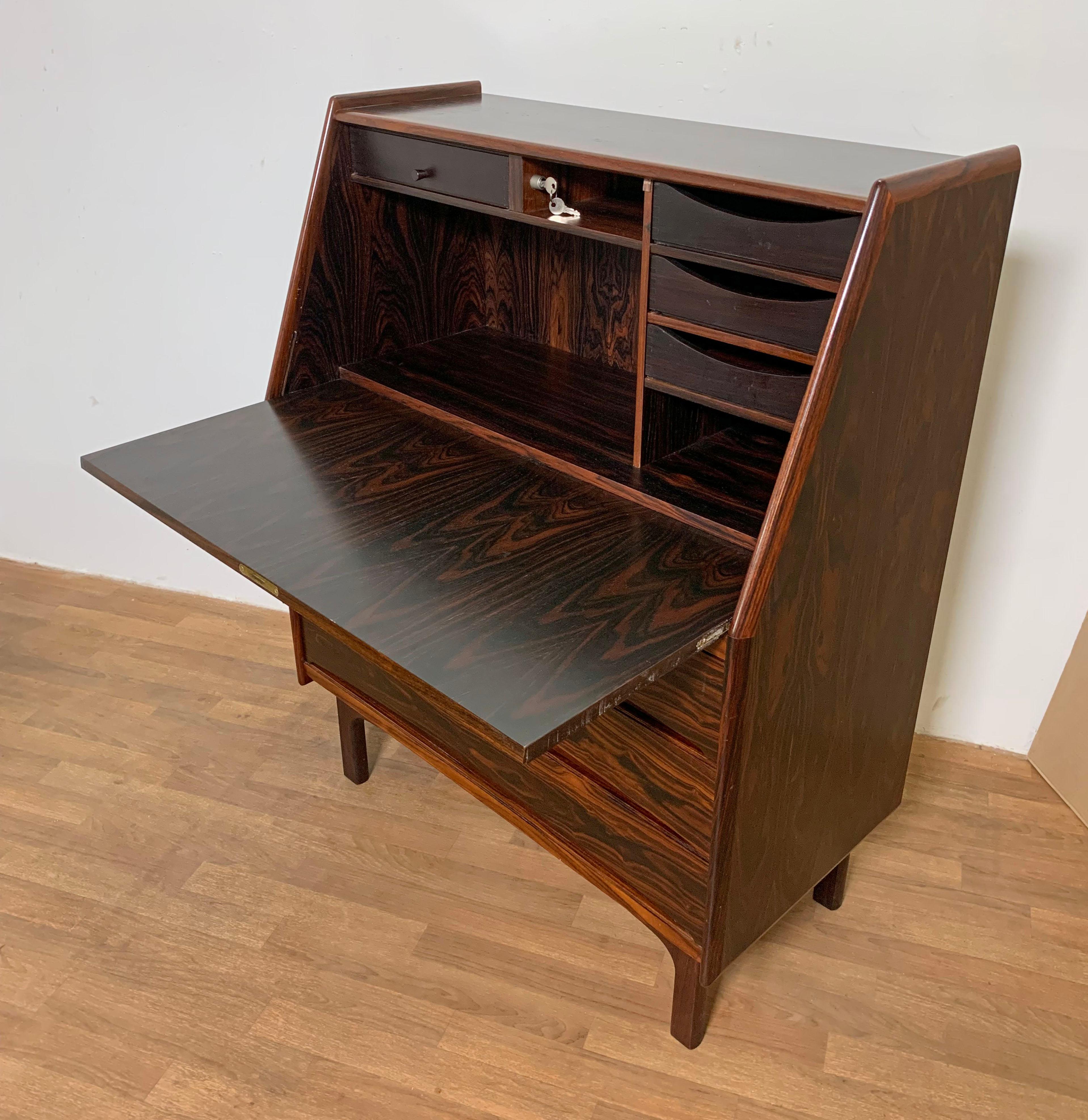 Rosewood secretary desk by Bernhard Pedersen, made in Denmark circa 1960s.

Measurements when closed: 35.5