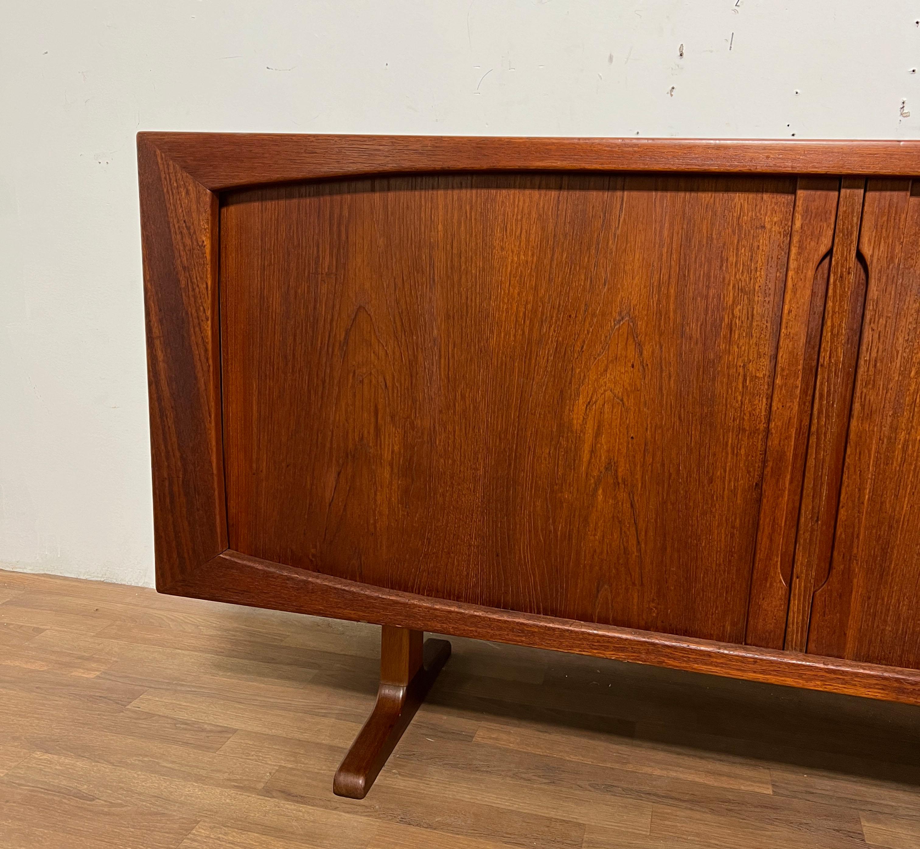A 1960s Danish teak two door tambour credenza with a finished back by Bernhard Pedersen & Sons.