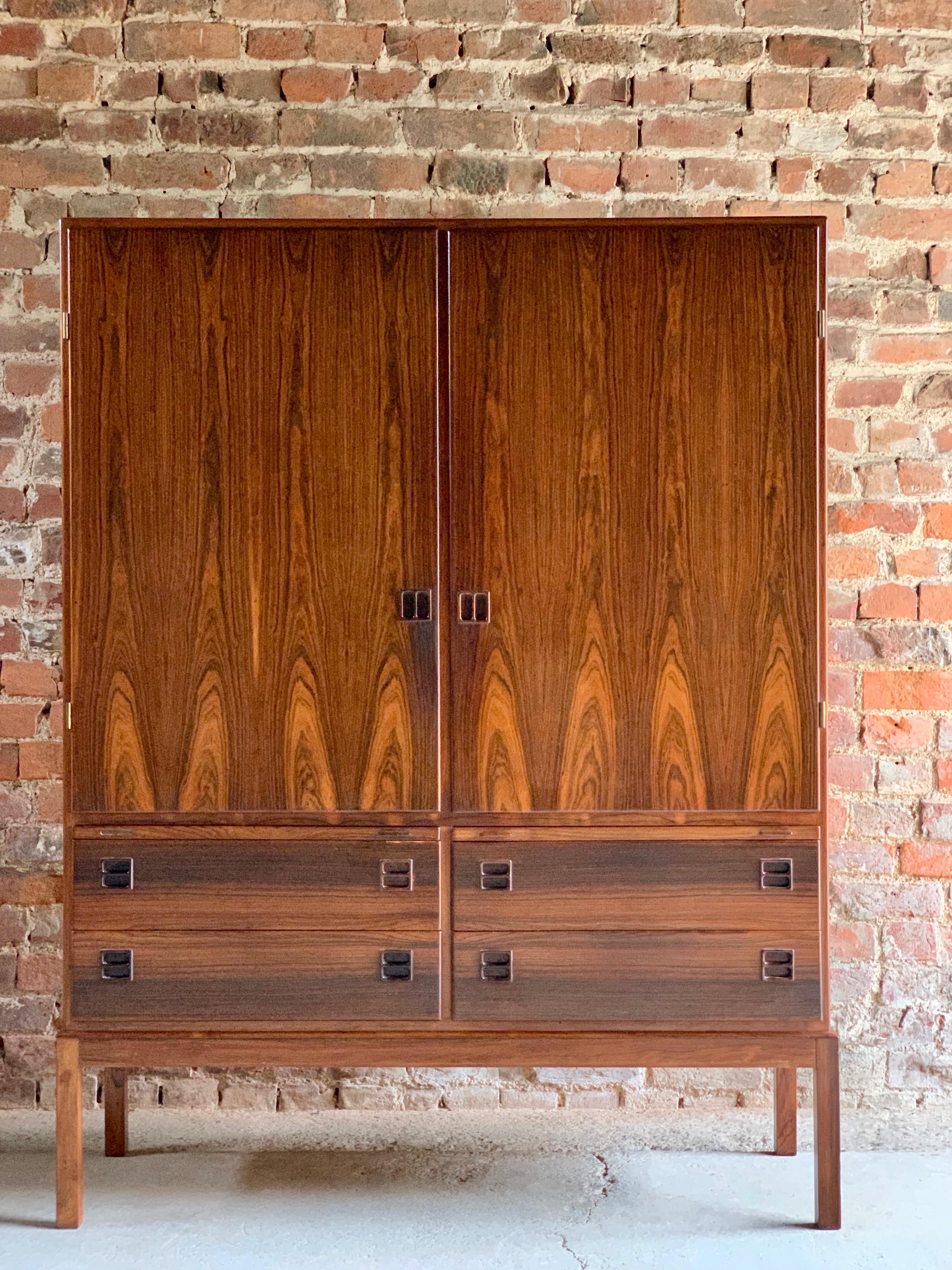 Bernhard Pedersen & Son Brazilian rosewood cabinet Denmark Mid-Century Modern, circa 1960.

Bernhard Pedersen & Son Brazilian rosewood cabinet Denmark circa 1960, the tall rectangular cabinet with two cupboard doors with five adjustable shelves