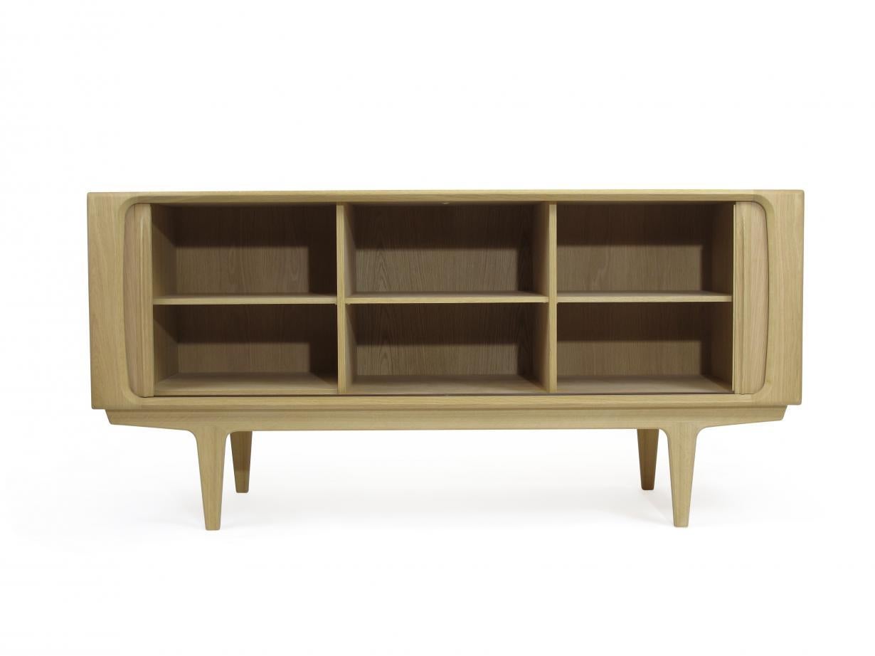 Bernh. Pedersen & Son Soaped oak sideboard no. 142 features tambour doors that roll seamlessly into the back. The interior of the cabinet is beautifully finished with adjustable shelves the curved front edges are constructed in solid oak as are the