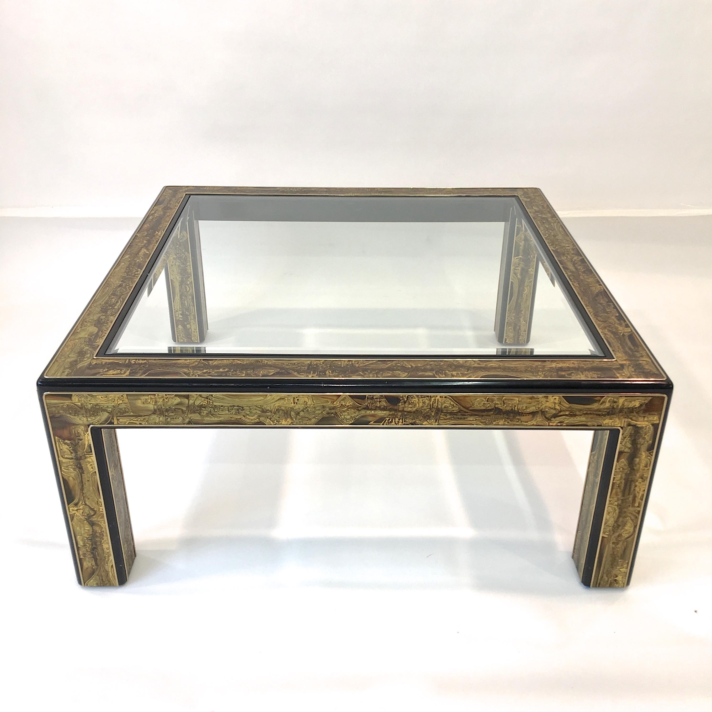 A square cocktail table created by metal sculptor Bernhard Rohne for Mastercraft circa 1970 in acid etched brass with ebonized wood and inset bevelled glass top.

See dining table version in late 1970s issue of H&G magazine: image # 20.

From