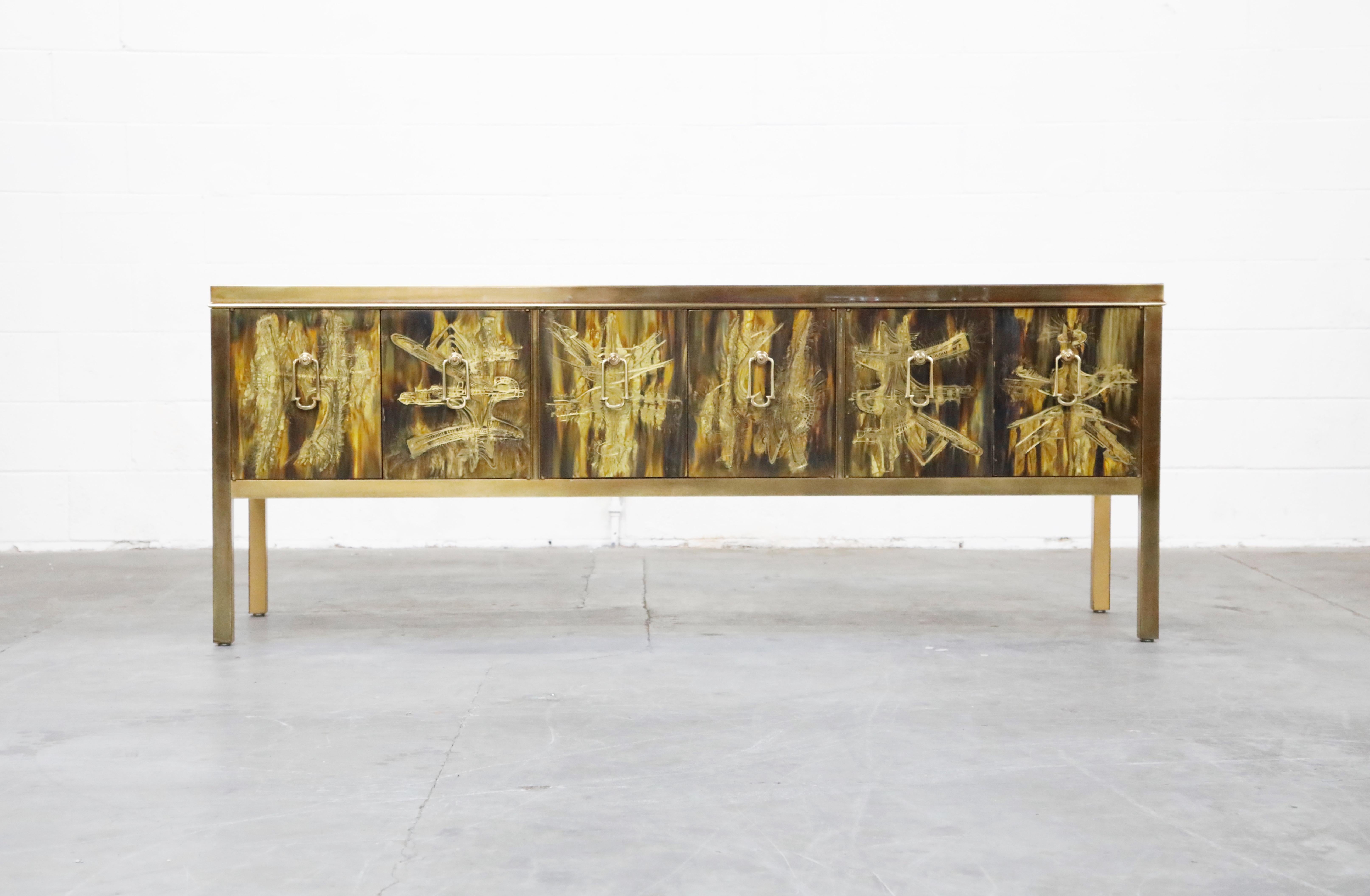 This incredible acid etched brass credenza was designed by Bernhard Rohne and produced by Mastercraft in the 1970s. Exquisite acid-etched artwork on the top, sides and front door panels with patinated brass trim and legs. Six doors and door pulls