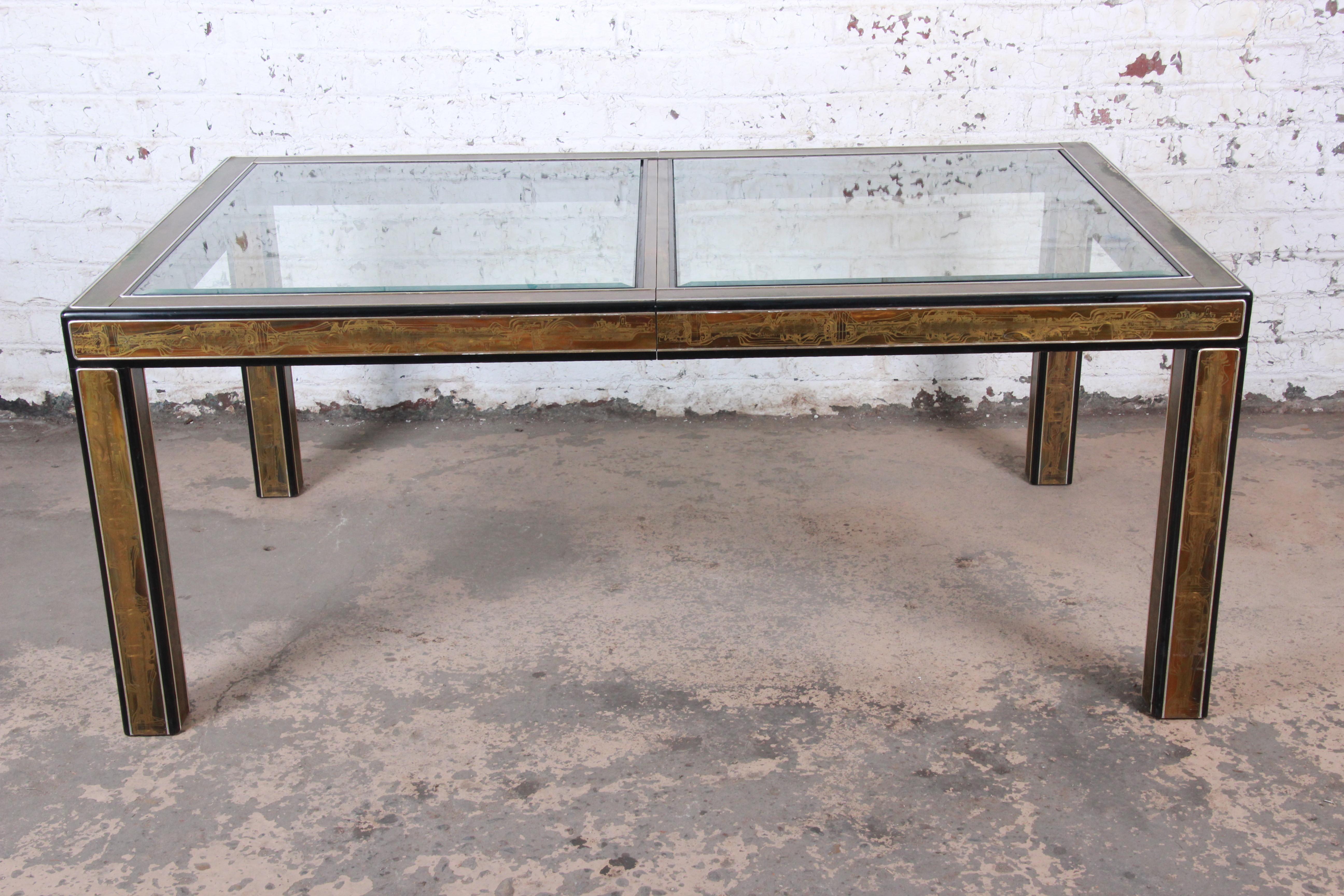 A gorgeous Mid-Century Modern Hollywood Regency acid etched extension dining table

By Bernhard Rohne for Mastercraft

USA, 1970s

Acid-etched brass, ebonized wood and beveled glass

Measures: 71.25