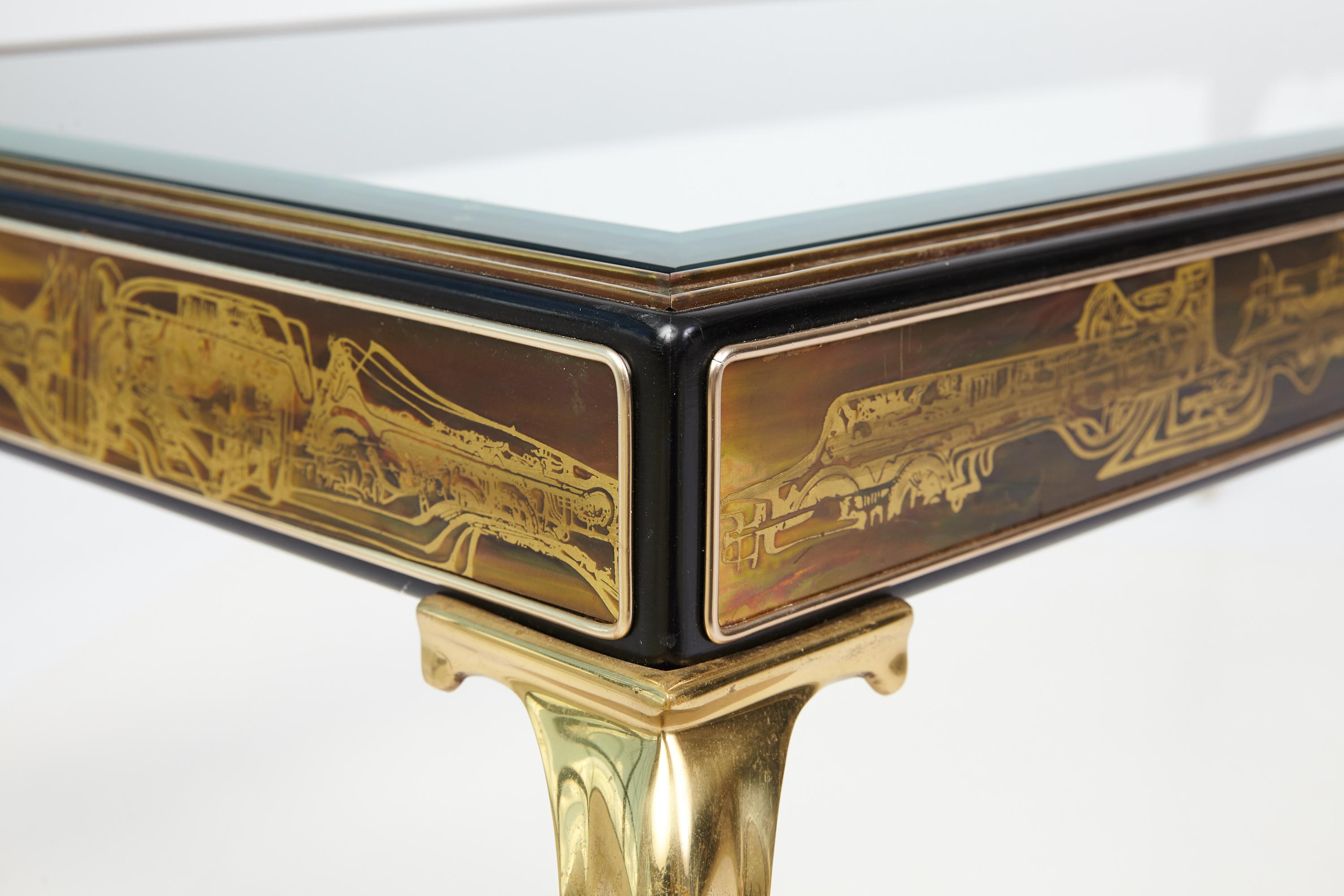 Glass top coffee / cocktail table with stylized cabriolet legs and side panels with acid etched design. A Mastercraft table designed by Bernhard Rohne with his signature decorative application.