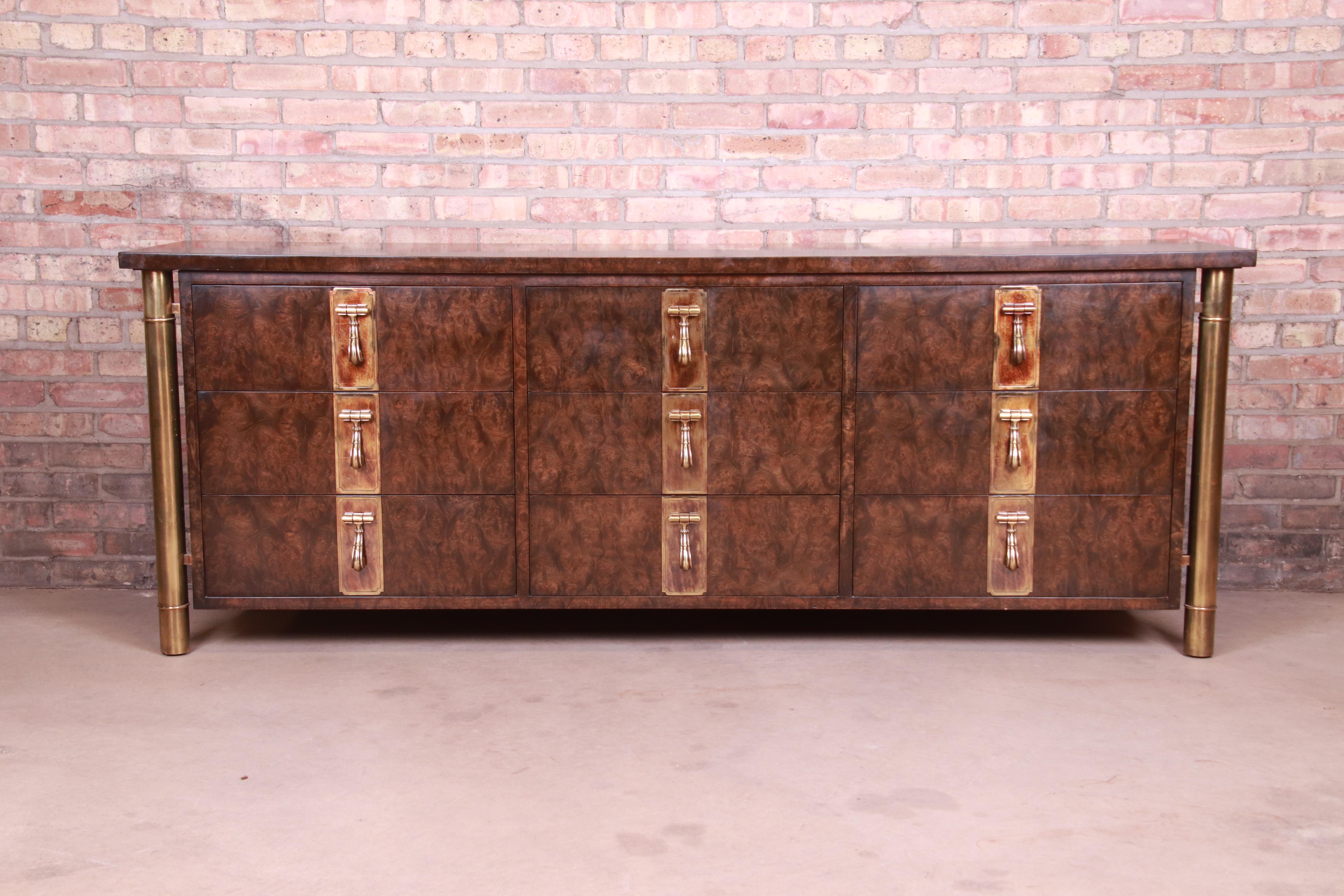 A gorgeous Mid-Century Modern Hollywood Regency triple dresser or credenza

By Bernhard Rohne for Mastercraft Furniture

USA, 1970s

Burled Carpathian elm wood, with brass legs and original brass hardware.

Measures: 84