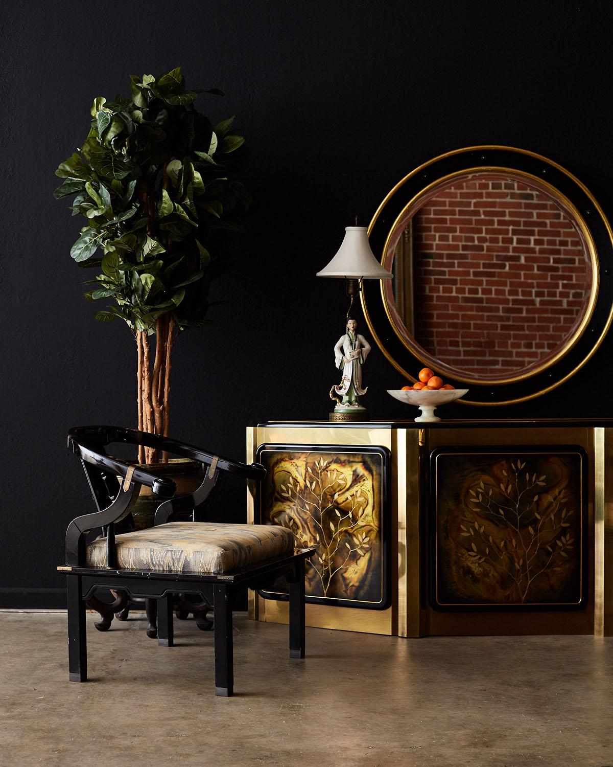 Elegant brass tree of life cabinet or credenza designed by Bernhard Rohne for Mastercraft. Features acid etched brass panel doors with a brass-clad case. The exposed wood trim has a high gloss ebony finish to contrast the brass. Each storage