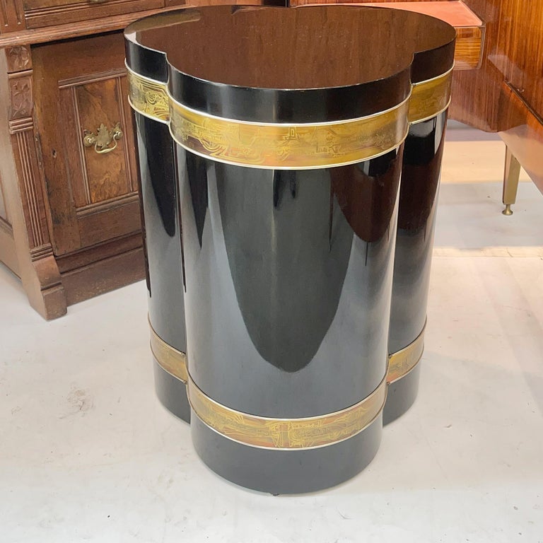 Mastercraft black lacquer trifoliate drum table base in polished black lacquer with bands of art metal acid-etched brass by artist Bernhard Rohne. 
Height is 27.5 inches and diameter 21 inches. 
Per the original Mastercraft catalog this table base