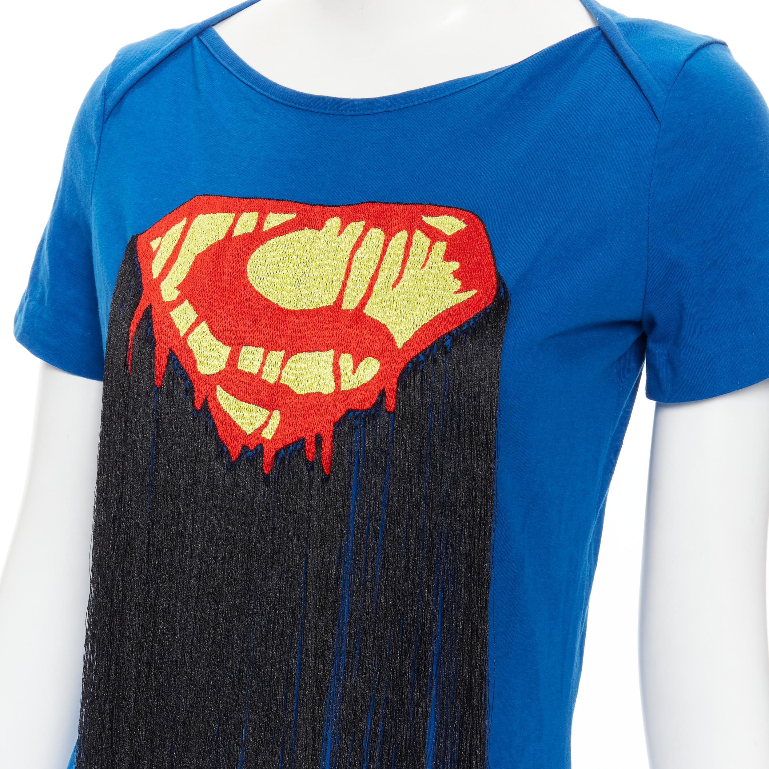 BERNHARD WILLHELM Superman embroidery black fringe blue cotton t-shirt M 
Reference: KNCN/A00002 
Brand: Bernhard Willhelm 
Designer: Bernhard Willhelm 
Material: Cotton 
Color: Blue 
Pattern: Solid 
Extra Detail: Fringe detailing. 

CONDITION: