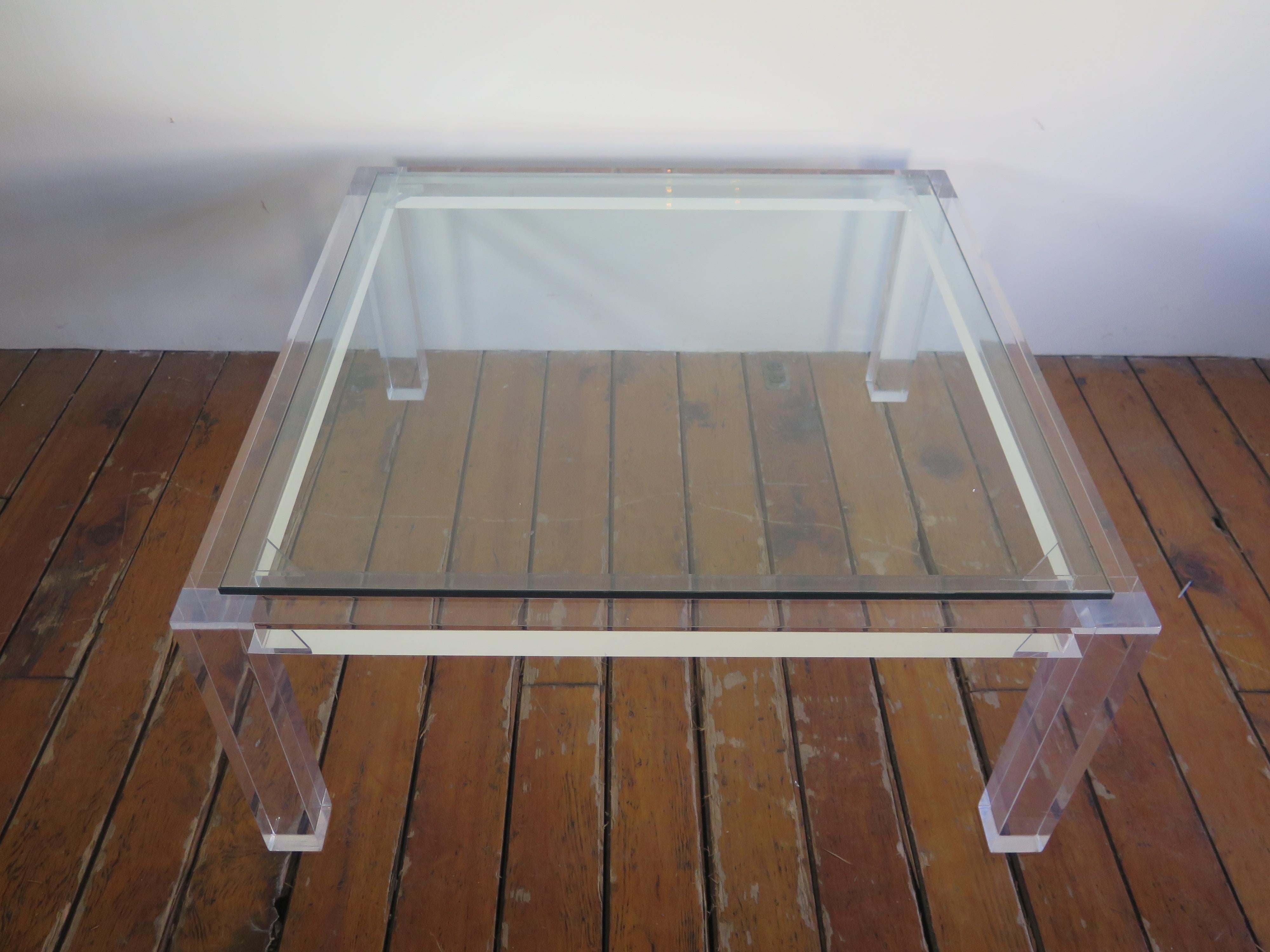 Clear Bernhardt acrylic square coffee table with glass top.