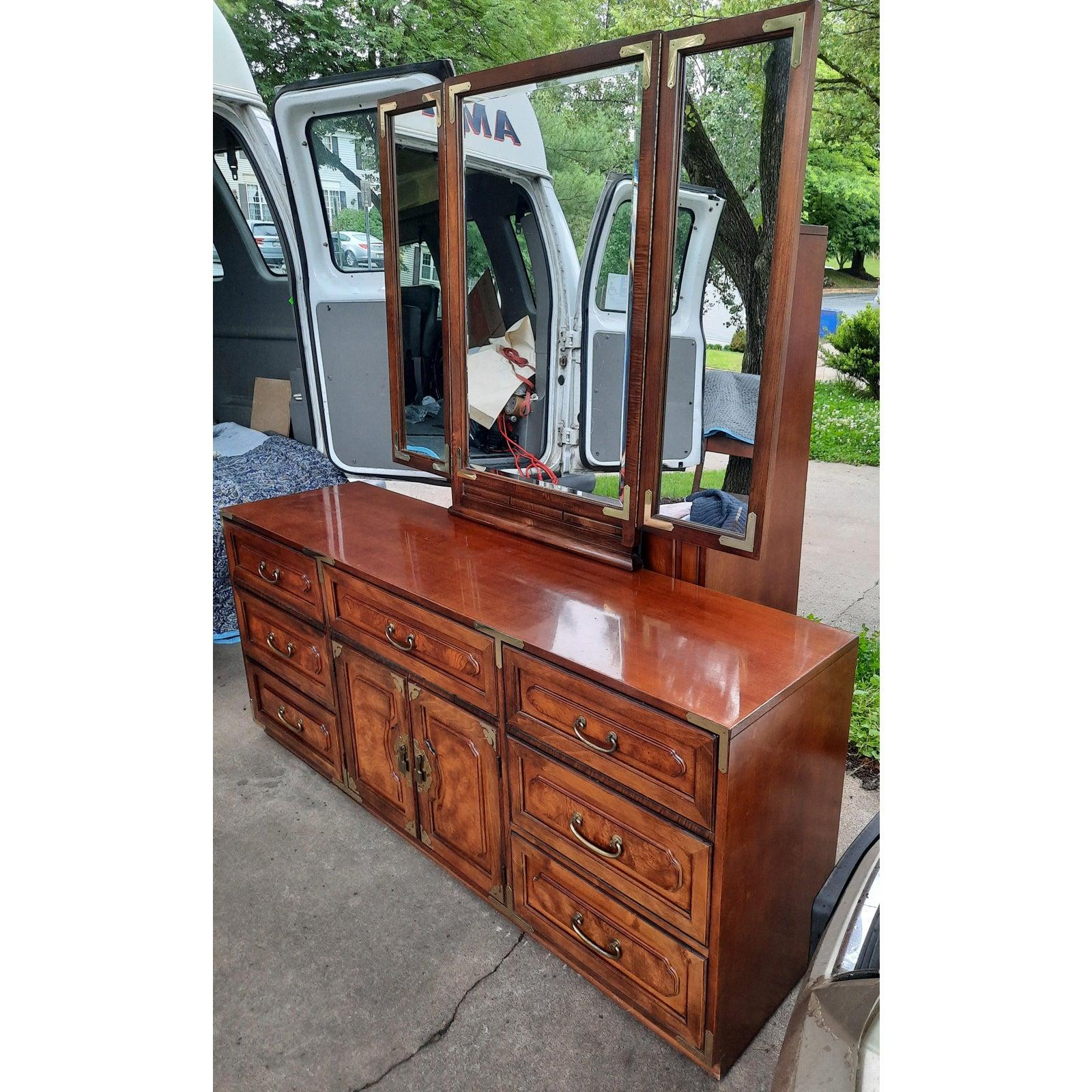 Rare Bernhardt American Asian campaign mahogany burlwood dresser with attached trifold mirror. Excellent vintage condition. please check out chairish store as we have the matching pair of Nightstands, the gentleman chest of drawers and the queen