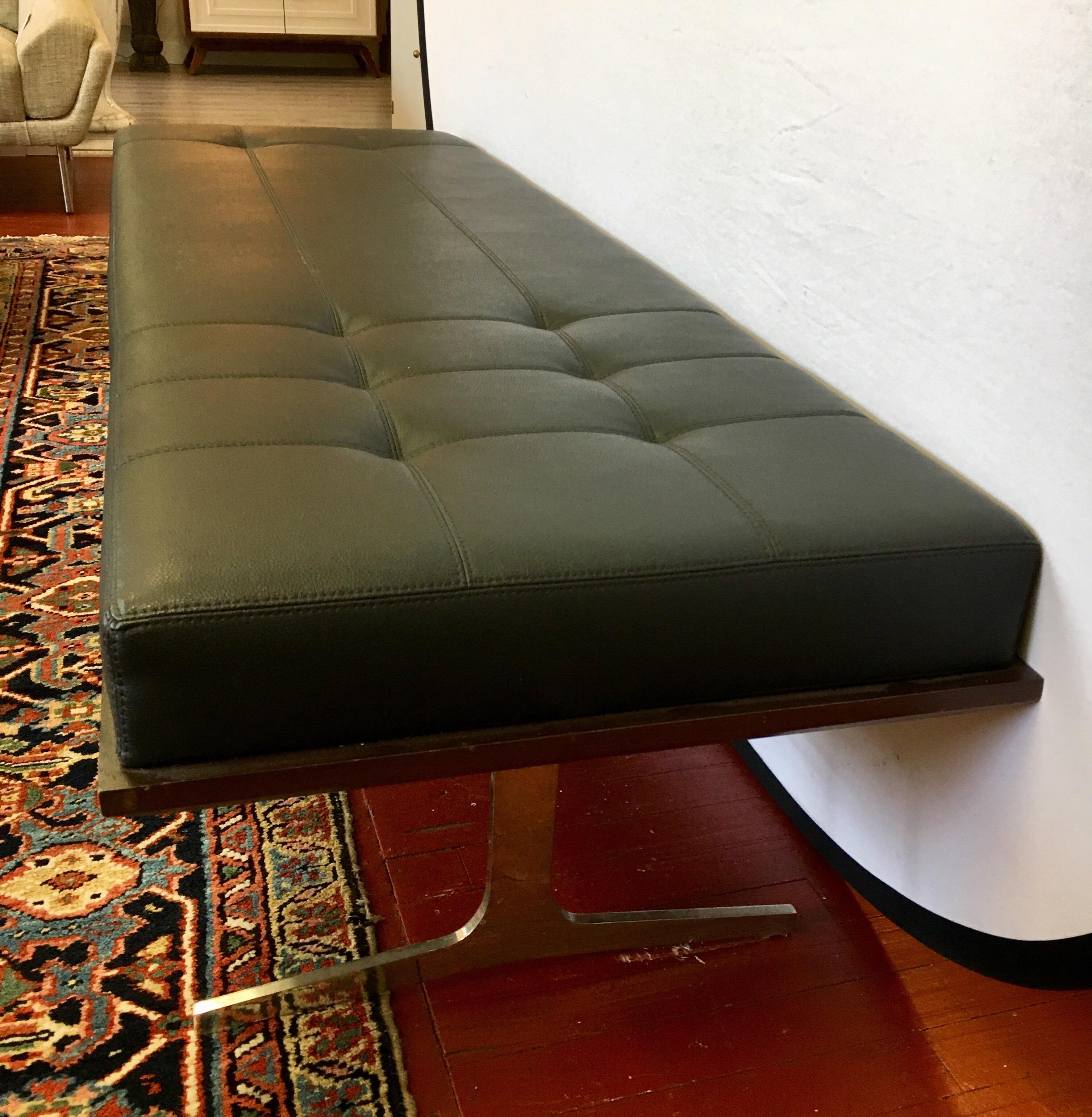 Elegant Berhardt black leather chaise lounge daybed with mahogany base and polished steel legs.
The leather is spectacular in its quality and quilting. This multi-purpose piece will make a great statement.