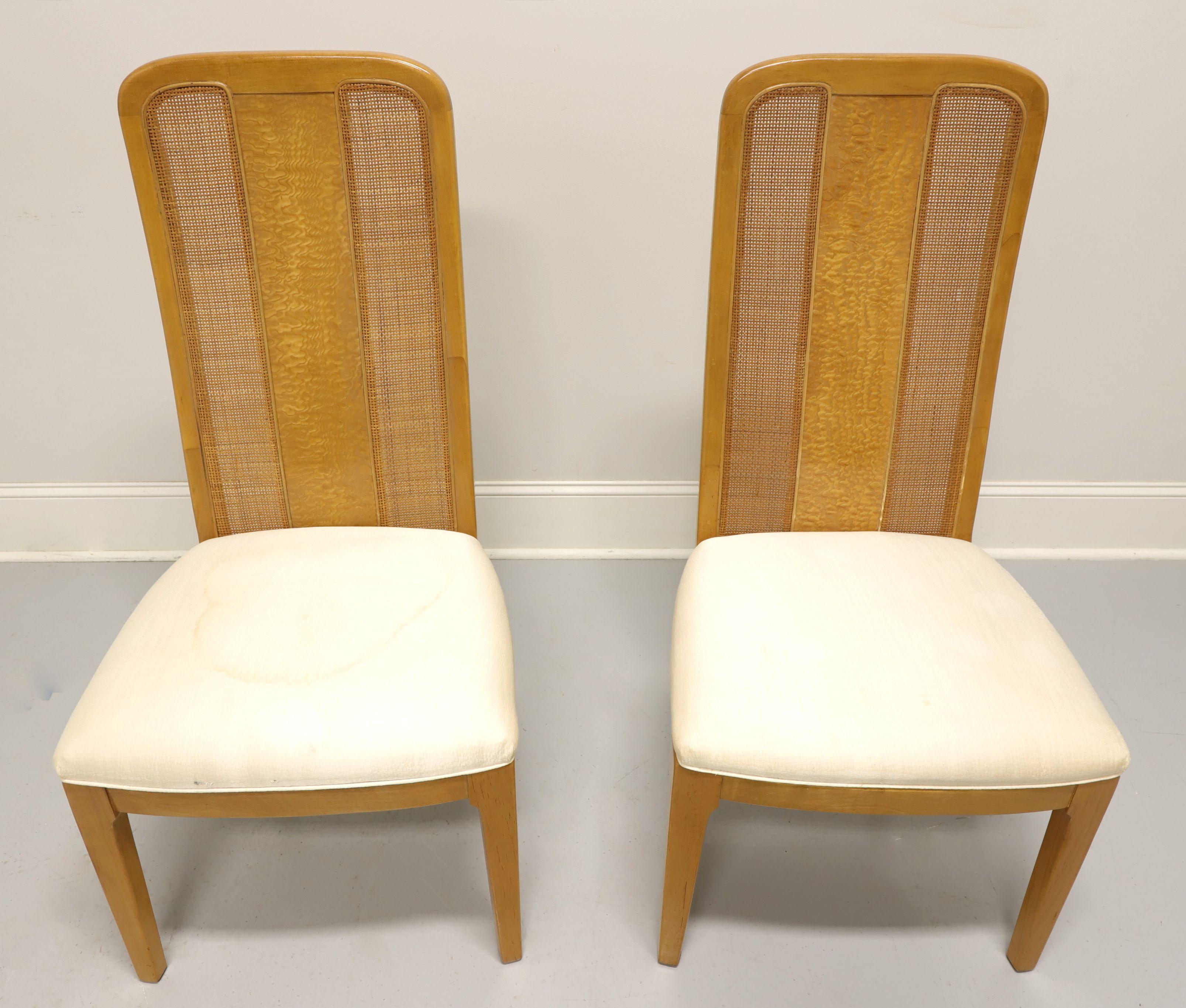A pair of Contemporary style dining side chairs by Bernhardt Furniture. Maple with burl & cane back rest, neutral cream color fabric upholstered seat and straight front legs. Made in North Carolina, USA, in the late 20th Century.

Measures: overall: