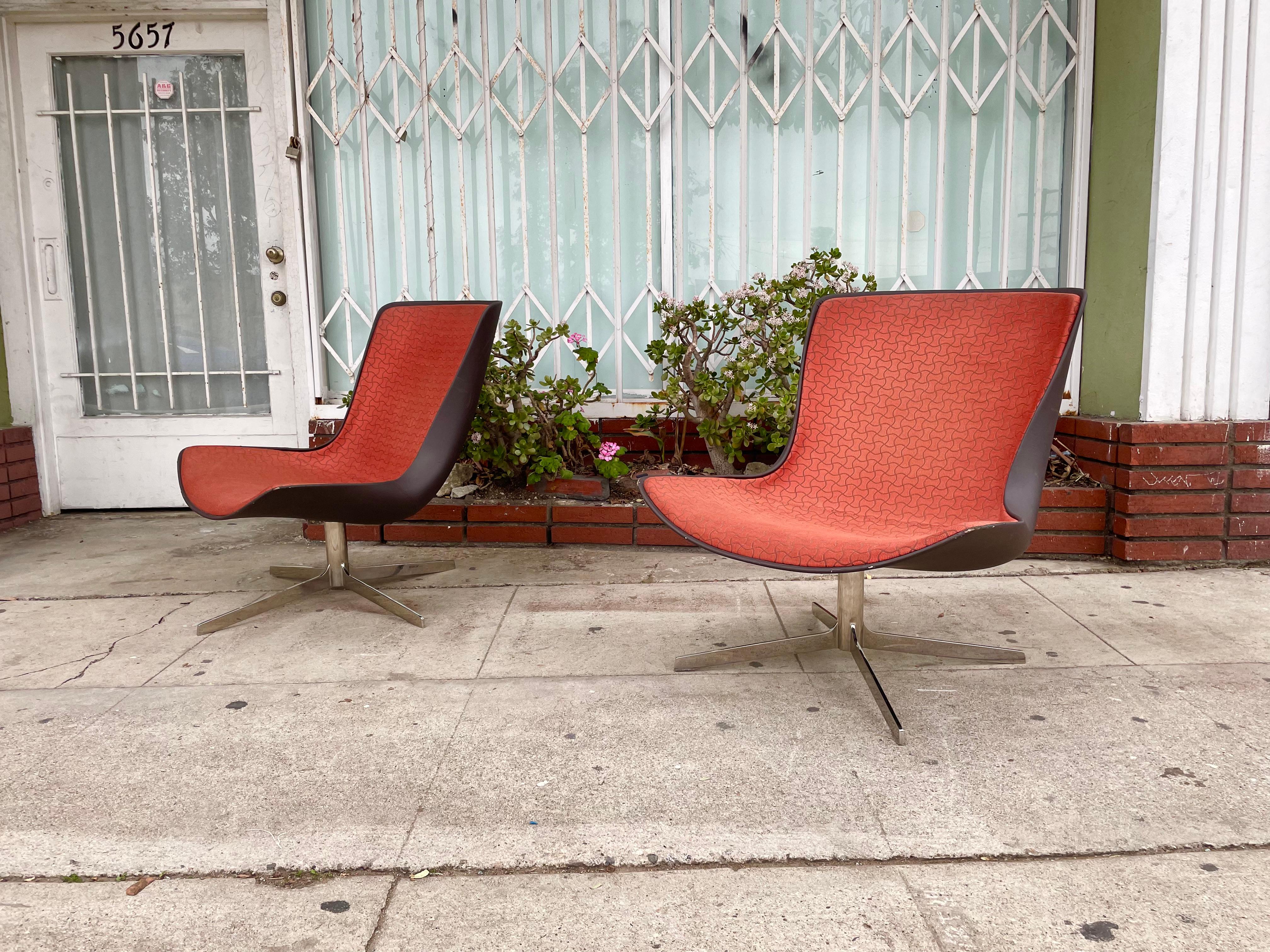 Fantastic Pair of Swivel Vika Lounge chairs by Bernhardt Design features a solid swivel chrome base giving it that very cool look. It also features comfortable foam cushioning. 