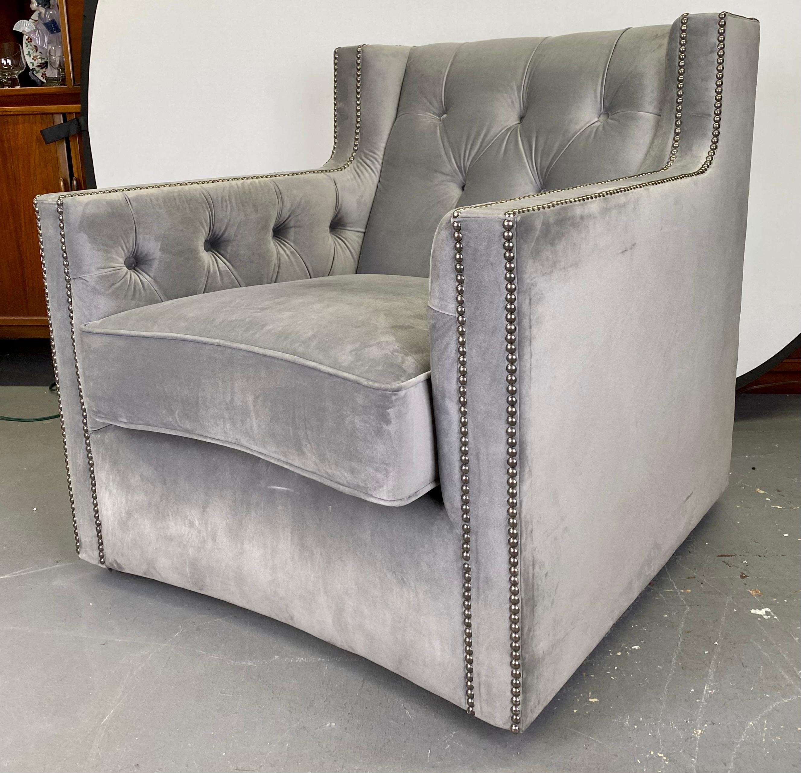 A Bernhardt Furniture club or lounge chair—a luxurious sanctuary crafted to elevate your living space. Immerse yourself in the chic charm of its large suede frame, adorned in a tasteful and versatile shade of gray that effortlessly complements any