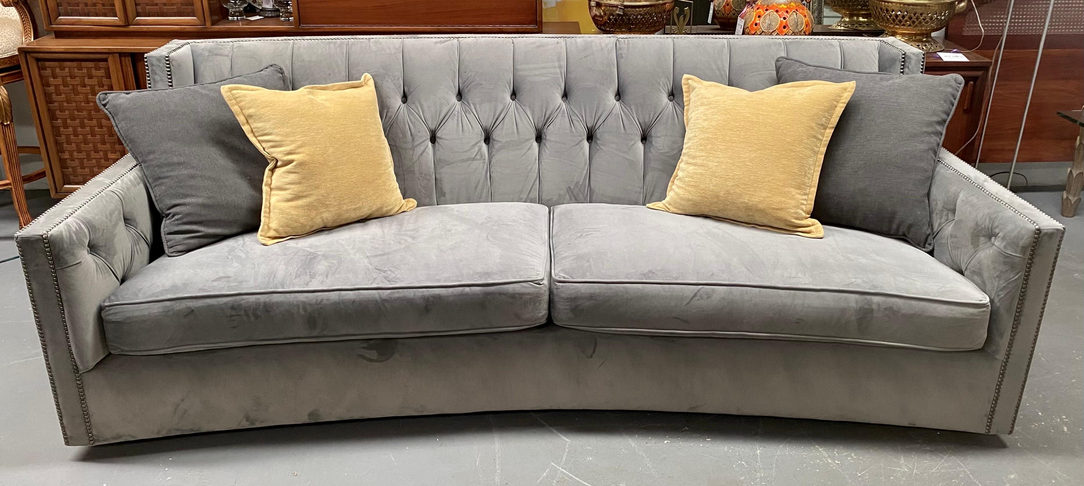 A Bernhardt Furniture Large Sofa—a luxurious sanctuary crafted to elevate your living space. Immerse yourself in the chic charm of its large suede frame, adorned in a tasteful and versatile shade of gray that effortlessly complements any decor.