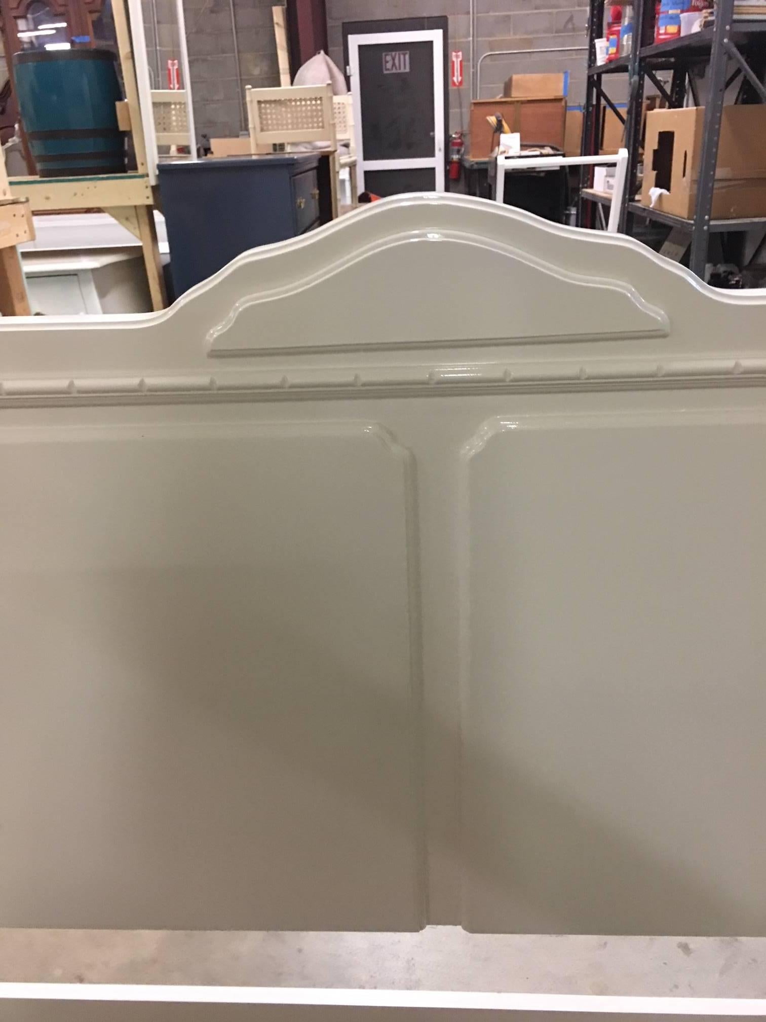 This headboard has just been freshly lacquered in Alabaster and is in perfect condition. It accompanies our listing for the Bernhardt triple dresser. Gilded brass hardware, elegant in its simplicity, this headboard is in perfect condition.  See
