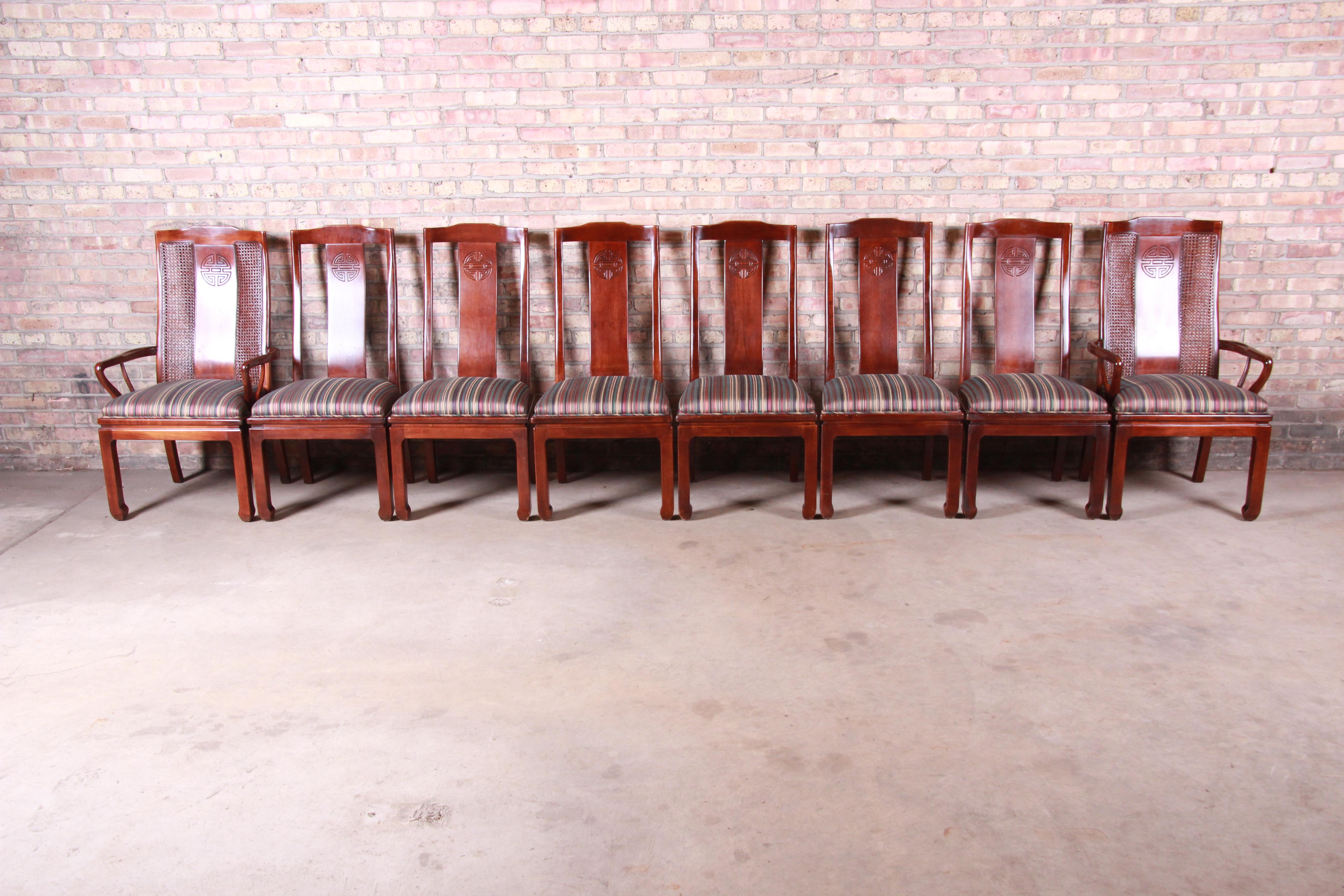 A gorgeous set of eight Asian inspired dining chairs

By Bernhardt

USA, circa 1980s

Mahogany and cane, with upholstered seats.

Measures:
Armchairs 24