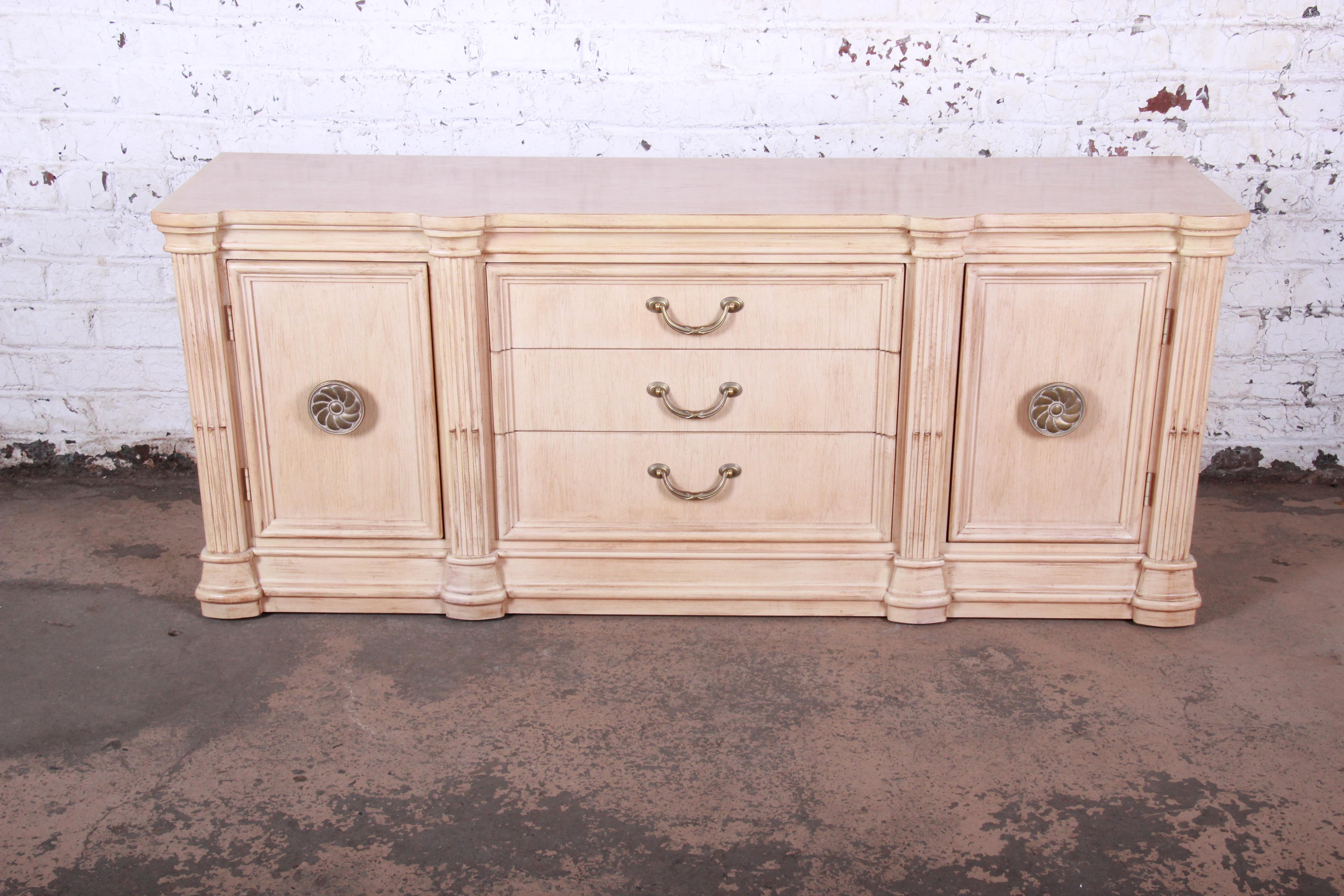 Mediterranean style maple sideboard credenza

Made by Bernhardt

USA, 1990s

Maple and brass

Measures: 72.5