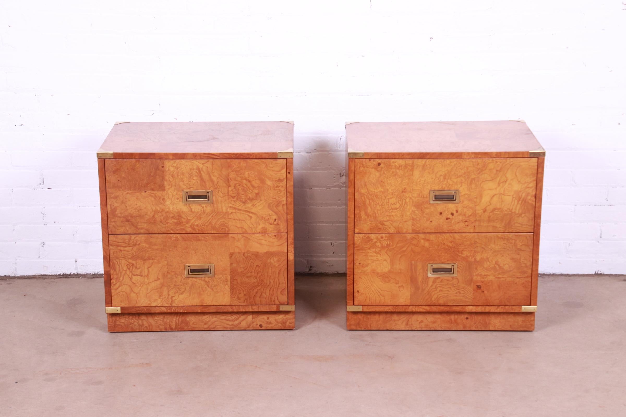 A gorgeous pair of mid-century modern Campaign style nightstands or side tables

By Bernhardt

USA, Circa 1970s

Burl wood, with original brass hardware and accents.

Measures: 24.25