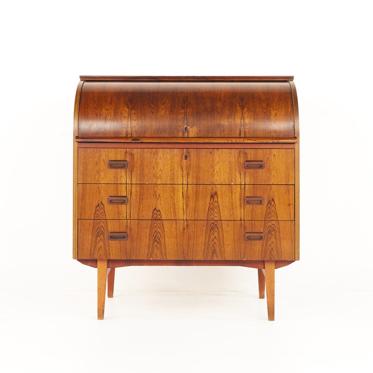 Bernhardt Pedersen Danish style mid-century rosewood roll top desk

The desk measures: 35.5 wide x 18.5 deep x 38.25 inches high

All pieces of furniture can be had in what we call restored vintage condition. That means the piece is restored upon