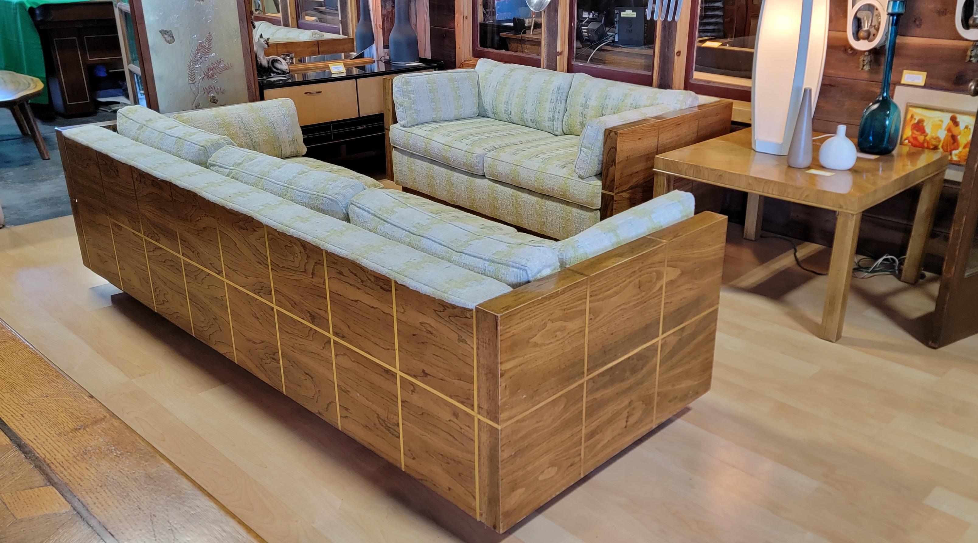 Matching sofa and loveseat by Bernhardt Furniture Company. Circa. 1970's. Designed in the manner of Milo Baughman. Nice addition to a Hollywood Regency or Mid-Century Modern interior. Very good original condition with original upholstery. Original