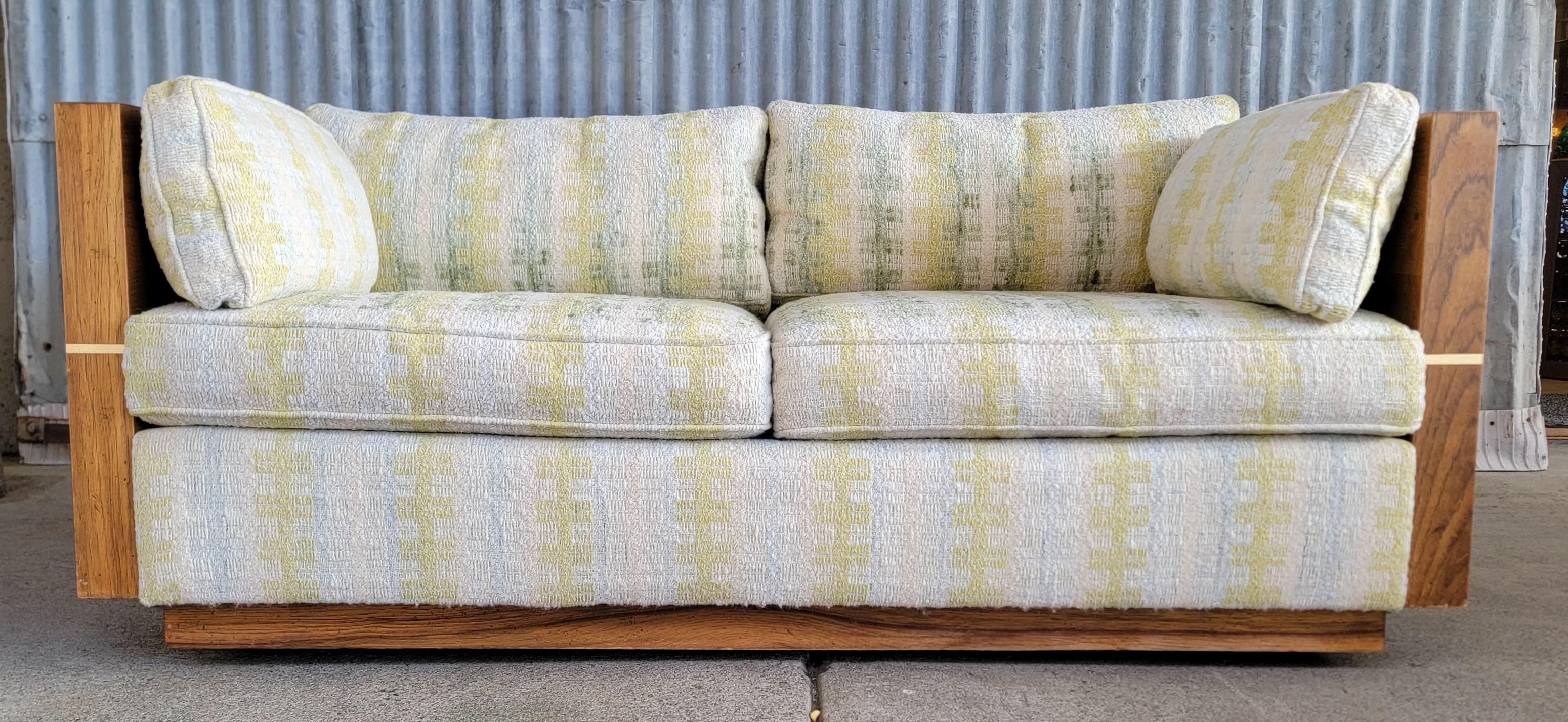 Sofa / Loveseat by Bernhardt Furniture Company. Circa. 1970's. Designed in the manner of Milo Baughman. Full wood sides and back. Nice addition to a Hollywood Regency or Mid-Century Modern interior. Very good original condition with original