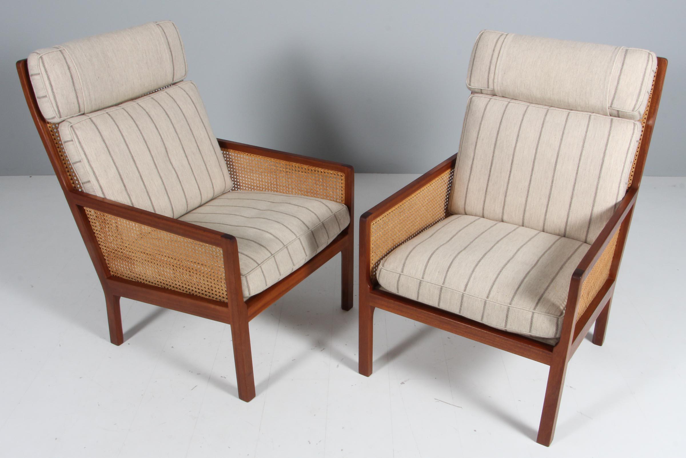 Bernt Pedersen pair of lounge chairs with frame of mahogany, back and sides from cane.

Original wool upholstery.

Made by Wørtz Snedkeri.