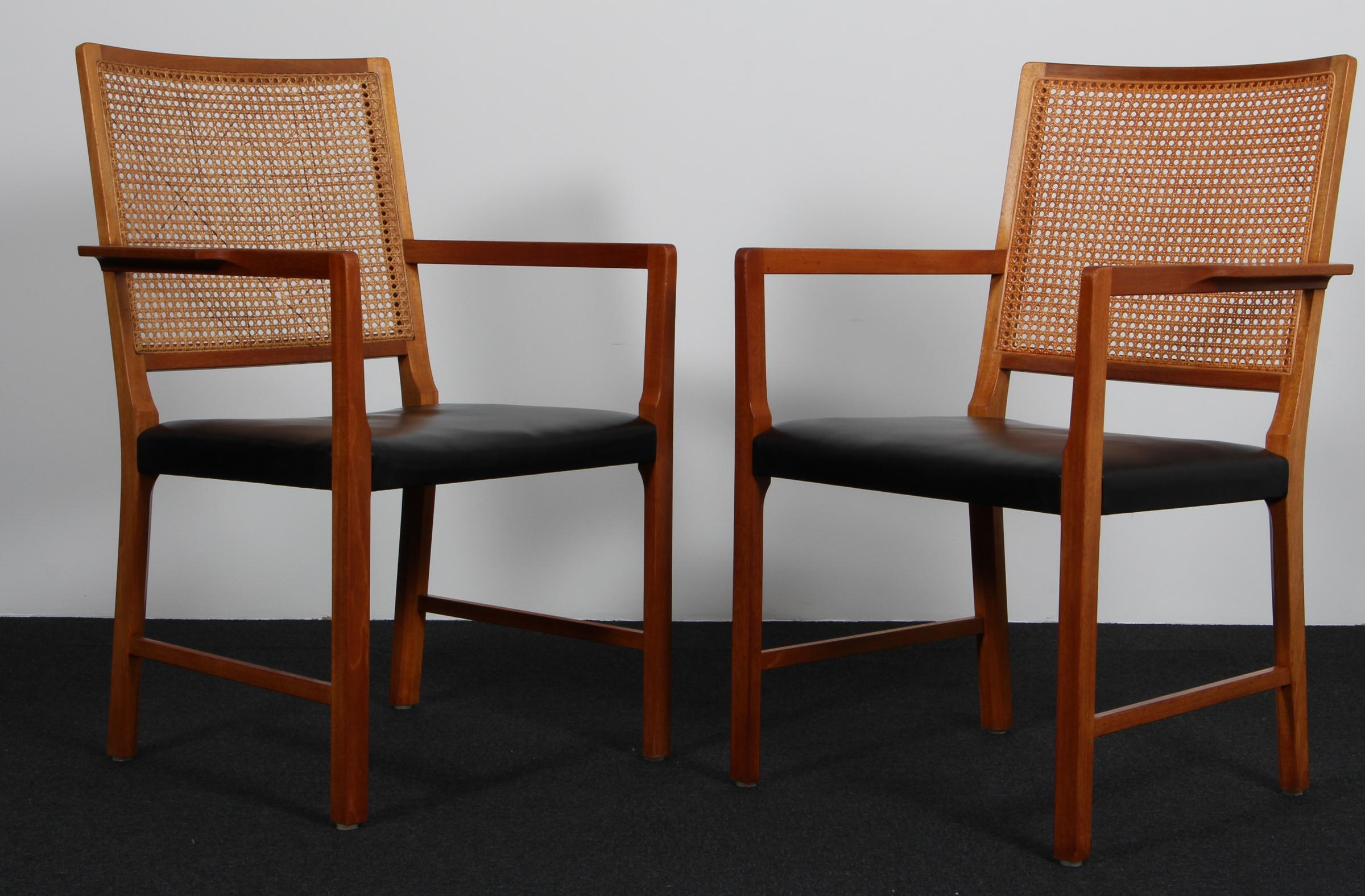 Bernt Pedersen pair of armchairs with mahogany frame and cane back.

Original black leather upholstery.

Made by Wørtz Snedkeri.