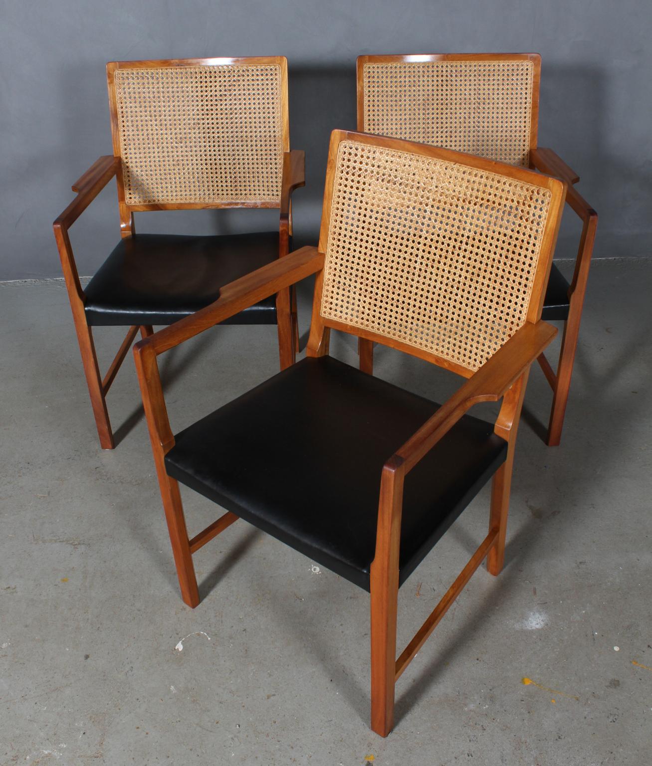 Bernt Pedersen set of armchairs with mahogany frame and cane back.

Original black leather upholstery.

Made by Wørtz Snedkeri.