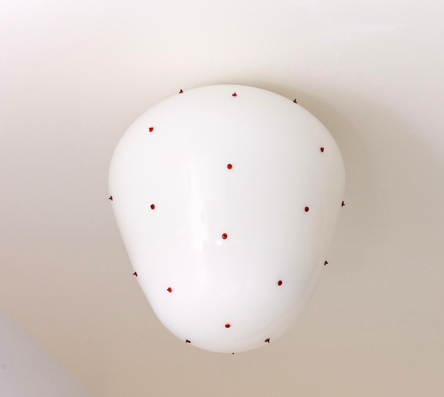 Berries blown glass wall light designed by French designer Duo Marie & Alexandre.

The Berries collection is handblown in Paris by a master glassblower, patiently handblown without the use of molds.
This meticulous process allows for subtle