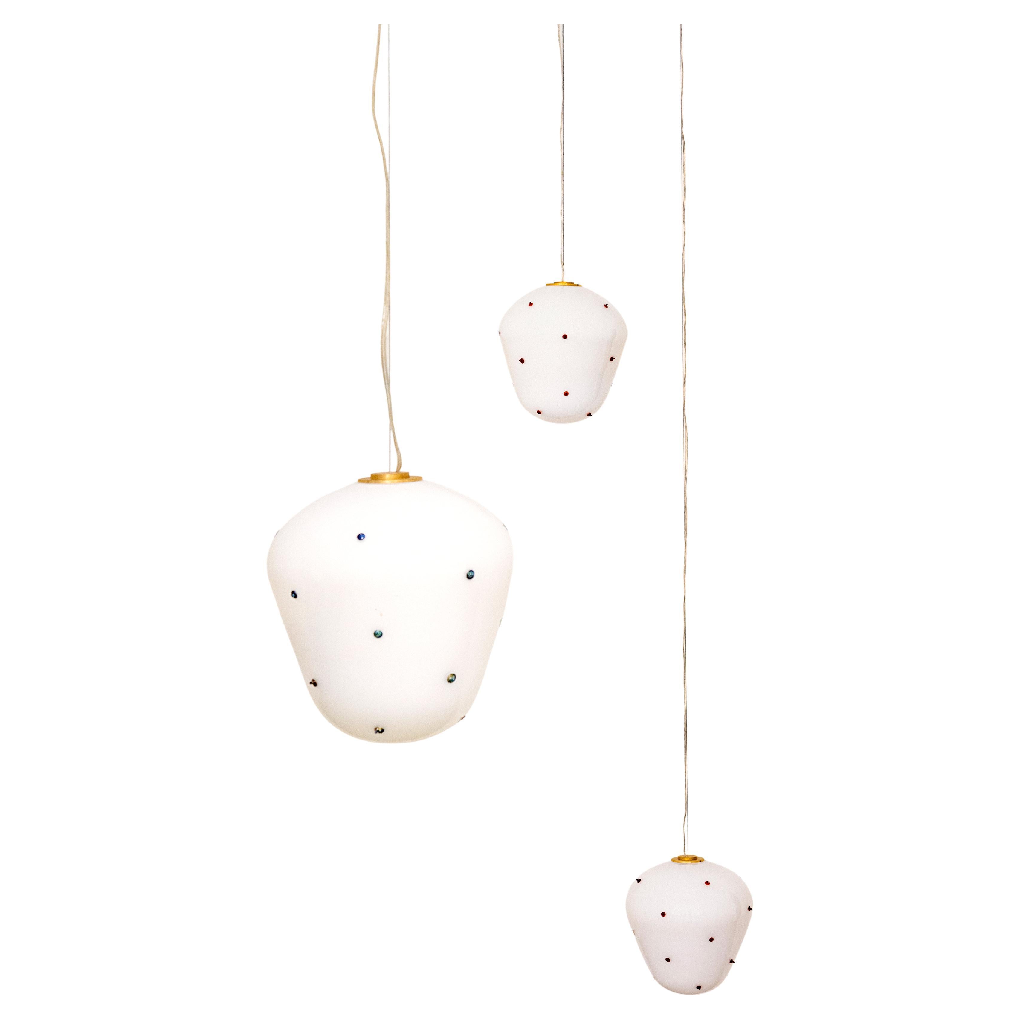 Berries blown glass pendant light designed by French designer Duo Marie & Alexandre.

The Berries collection is handblown in Paris by a master glassblower, patiently handblown without the use of molds.
This meticulous process allows for subtle