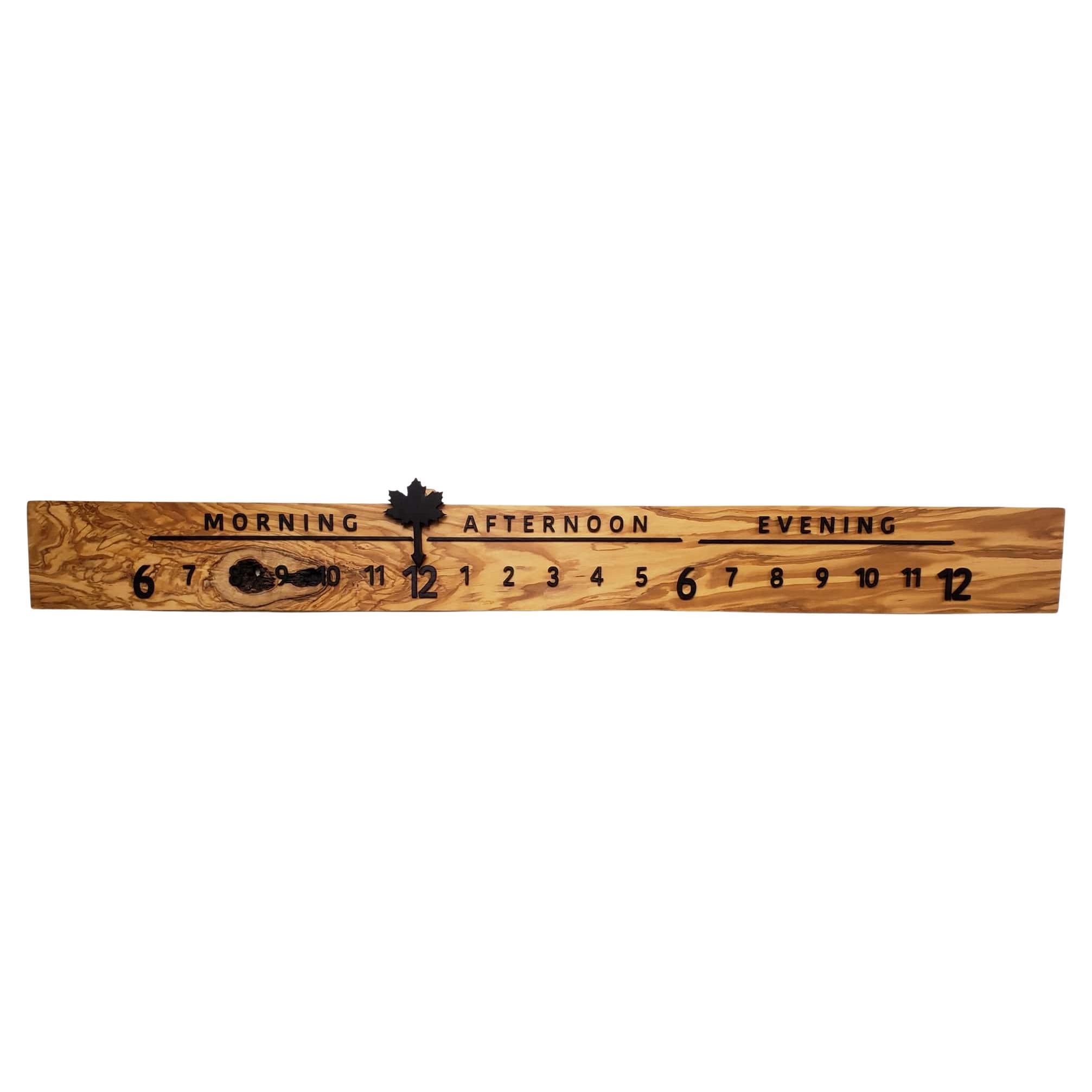Berry features a stunning Linear Clock made of Olive wood, perfectly complemented by the raised lettering and pointer in Wenge. The composition is dramatic and satisfying to behold. The lusciously varying tones in the Olive wood feel like an