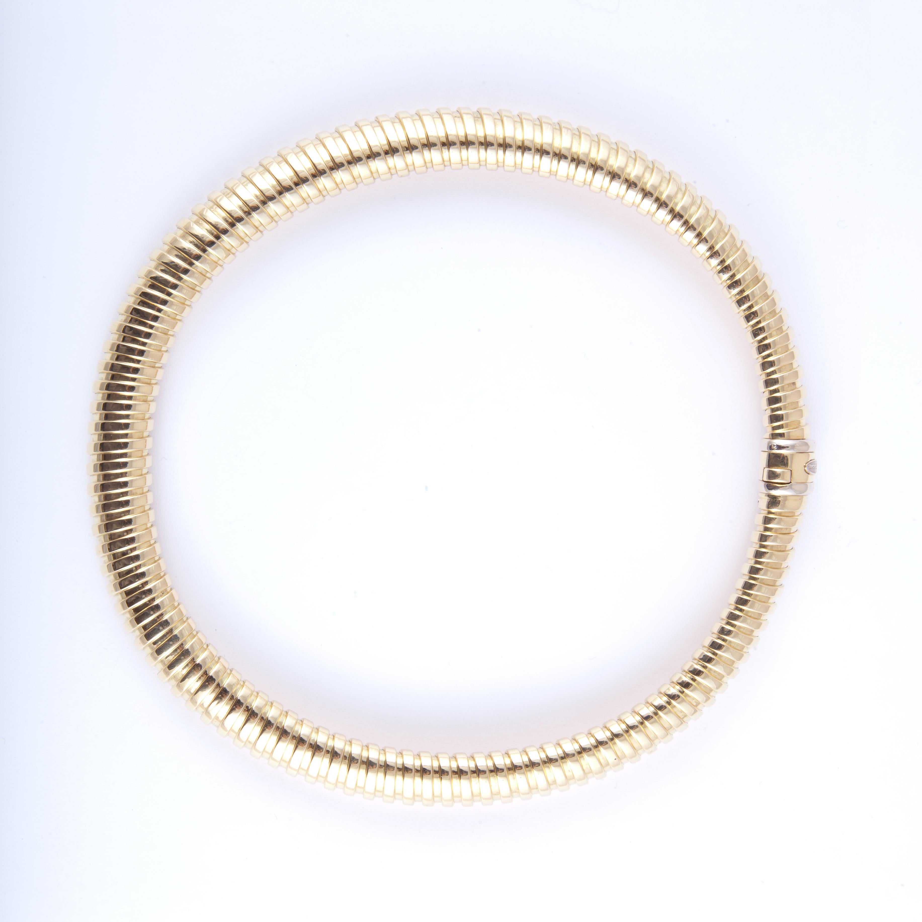 Bersoni tubogas style necklace in 18K yellow gold with a tongue insert closure.  The necklace measures 19 inches in length and 1/2 inch wide.  Necklace has very nice weight and lays great on the neck.