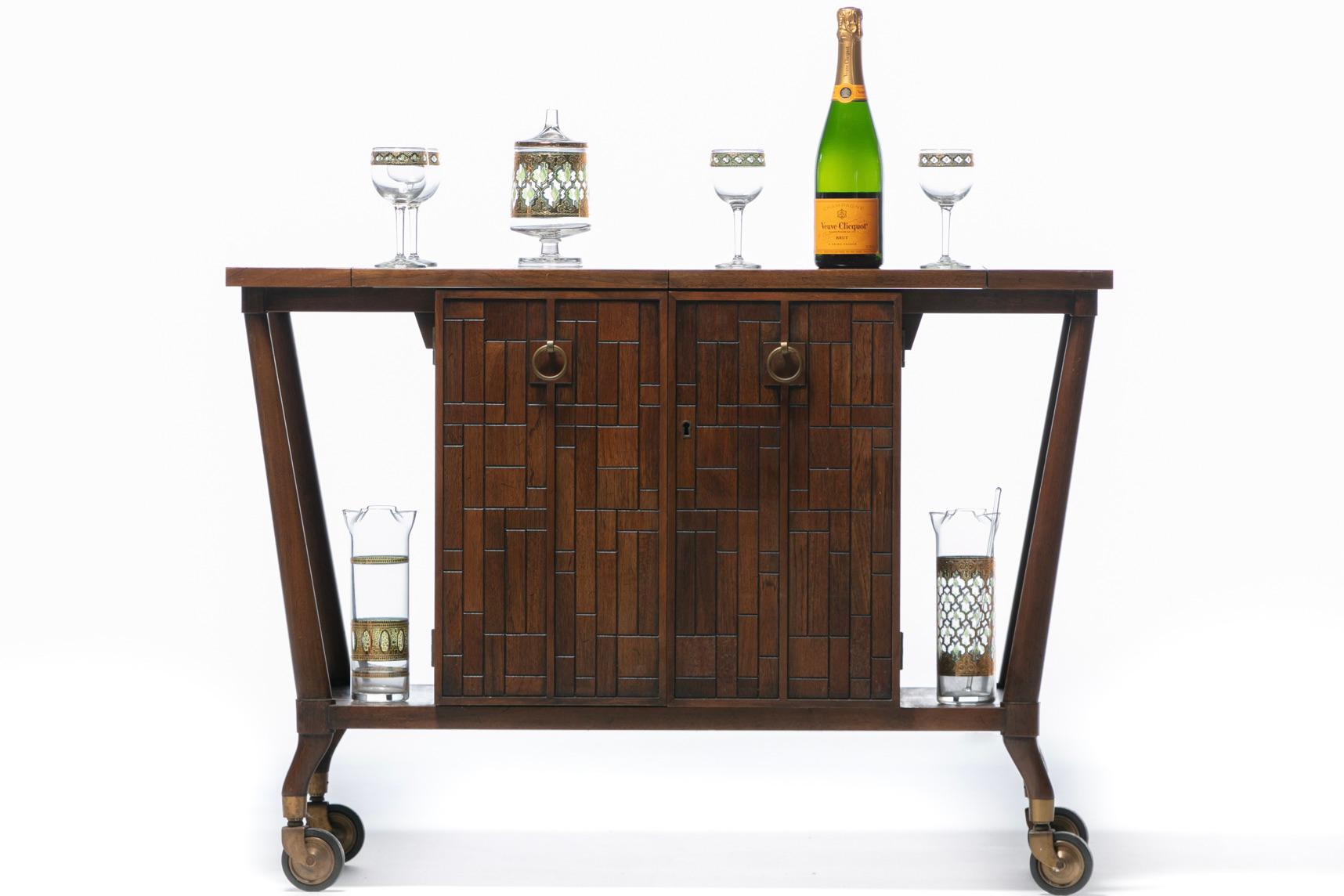 Forward Trend Brutalist Mid-Century Modern walnut bar cart designed by Bert England for Johnson Furniture circa 1960. This is a well known and admired Mid-Century Modern Brutalist bar cart represented in several early 1960s Architectural Digest