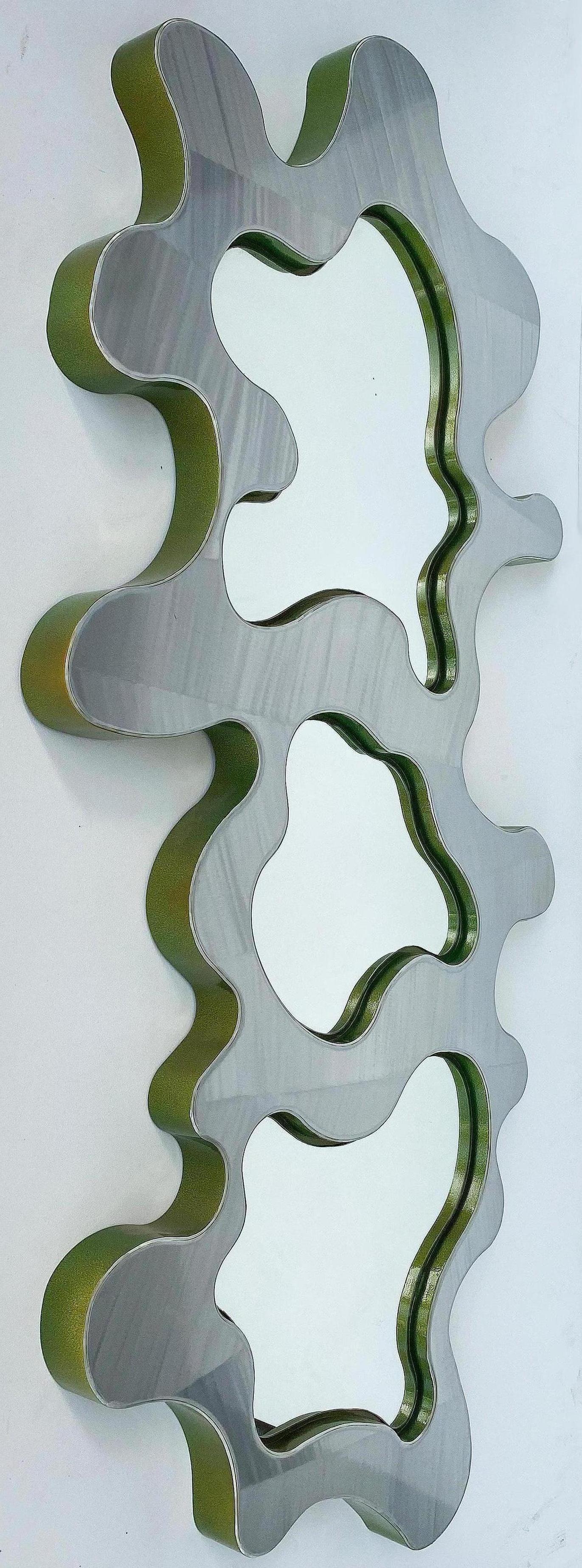 Offered for sale is a Bert Furnari powder-coated three-panel aluminum mirror. The mirror has a polished surface with sides that are powder-coated in an avocado green finish. Bert Furnari (b.1968) works out of Easton, PA where he has his
