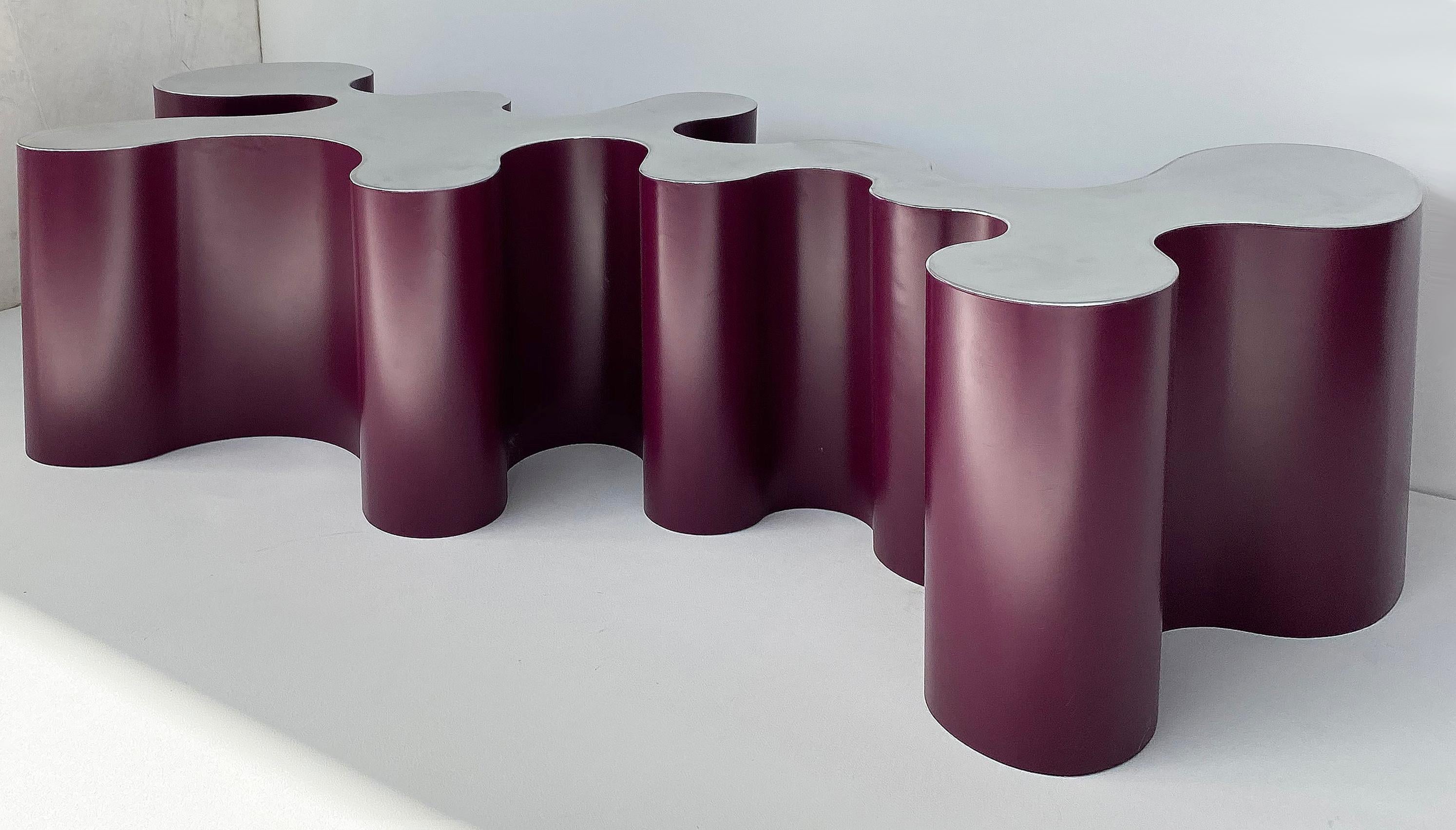 Bert Furnari sculptural aluminum coffee table base with plum enameled sides

Offered for sale is a Bert Furnari sculptural aluminum coffee table base with plum enameled sides. This very sculptural and unique coffee table can be used with a glass top