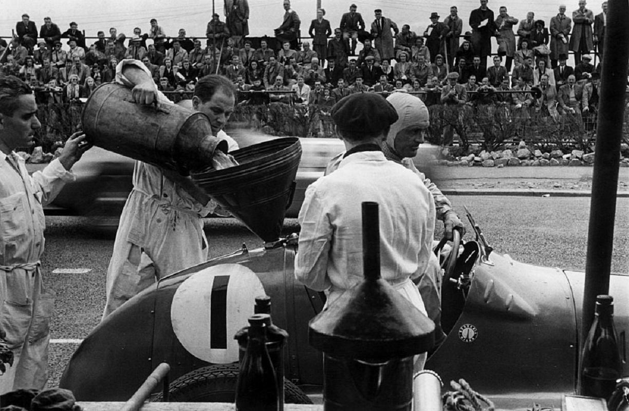 "Fill Her Up" by Bert Hardy

24th May 1947: Pit staff filling up Louis Chiron's (1899 - 1979) Maserati. Original Publication: Picture Post - 4364 - Road Racing In Jersey - pub. 1947

Unframed
Paper Size: 20" x 30'' (inches)
Printed 2022 
Silver