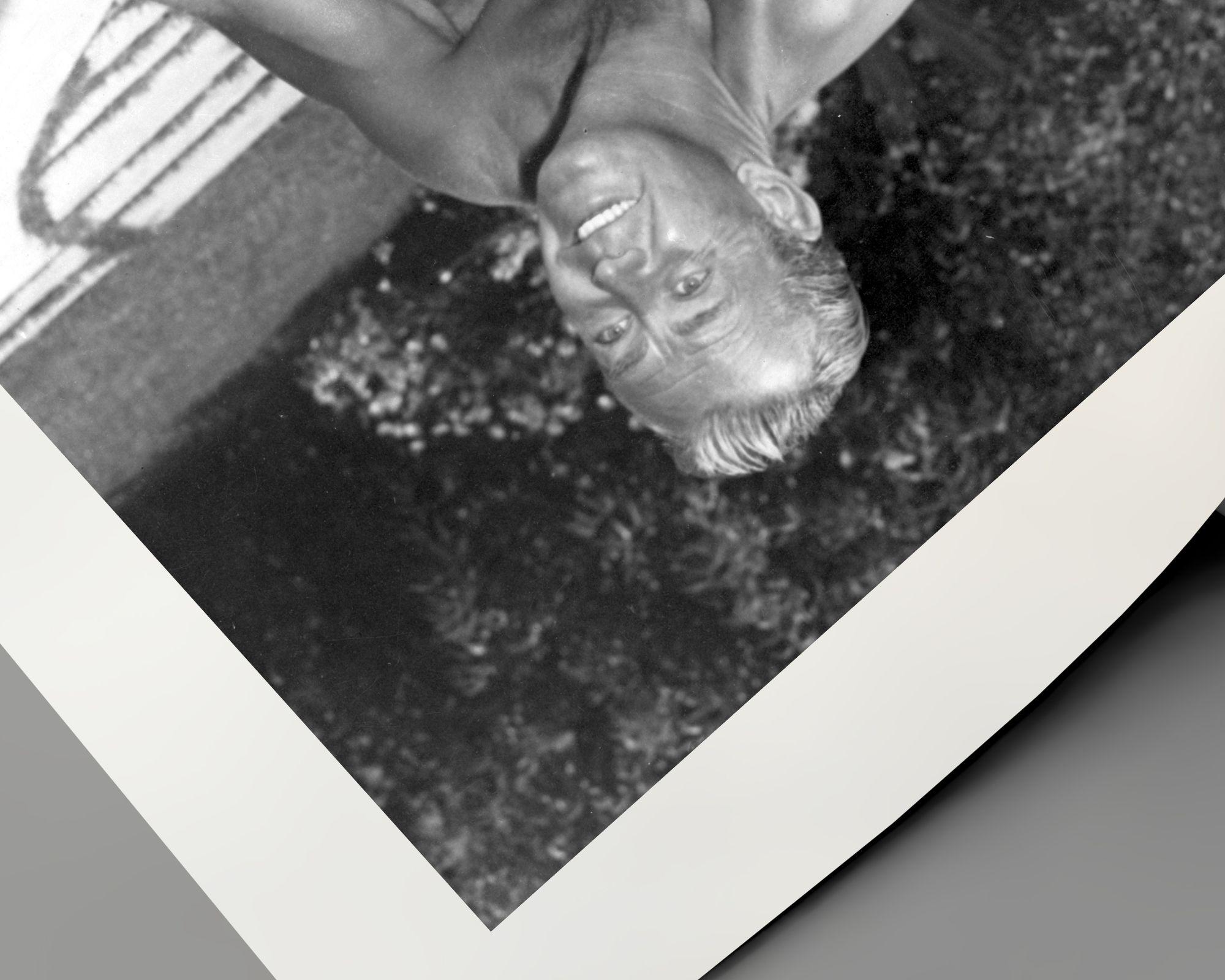 Alan Ladd Playing with Dog in Pool - Contemporary Photograph by Bert Six