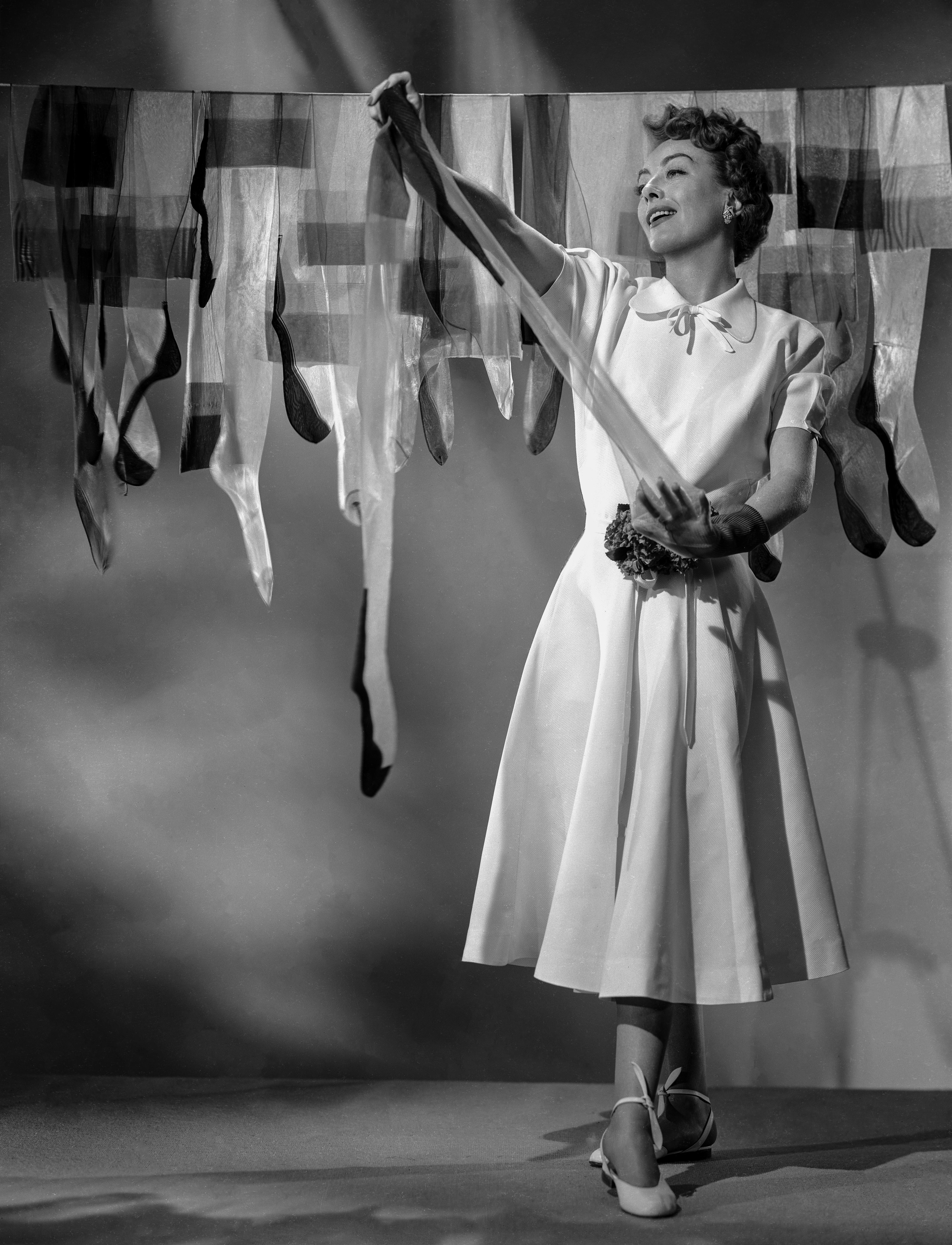 Bert Six Black and White Photograph - Joan Crawford Hanging Laundry Fine Art Print