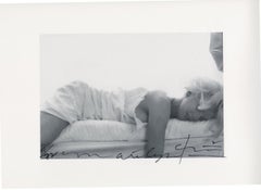 Marilyn Monroe . Passed out on the bed . The last sitting