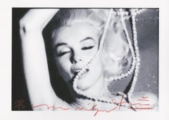 Marilyn Monroe  The last sitting Pearls 1 by Bert Stern .