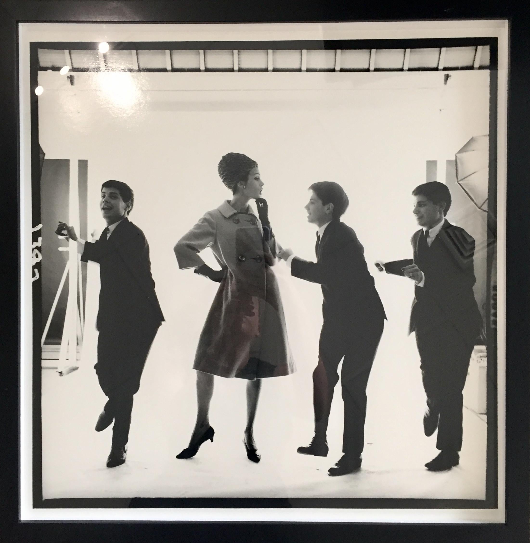 Bert Stern Abstract Photograph - Triplets Edward, Dennis, Michael Magid Dancing with Model In Jersey Coat, 1963